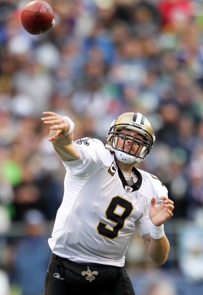 SEATTLE, WA - JANUARY 08:  Quarterback Drew Brees #9 of the New Orleans Saints throws the ball against the Seattle Seahawks during the 2011 NFC wild-card playoff game at Qwest Field on January 8, 2011 in Seattle, Washington.  (Photo by Otto Greule Jr/Gett