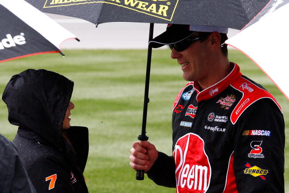 LAS VEGAS - FEBRUARY 27: Danicas Patrick (L), driver of the #7 GoDaddy.com Chevrolet, talks with Kevin Harvick, driver of the #33 Rheem Chevrolet, after rain delayed the start of the NASCAR Nationwide Series Sam's Town 300 at Las Vegas Motor Speedway on F