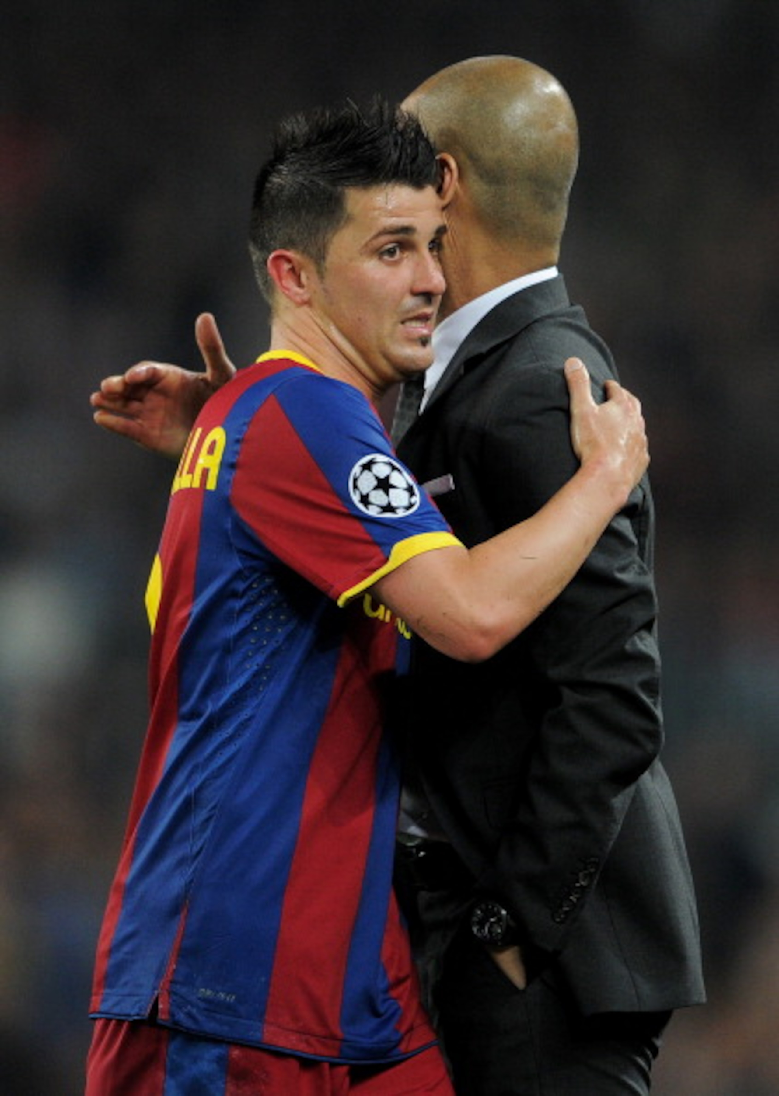 BARCELONA, SPAIN - APRIL 06:  David Villa (R) of Barcelona embraces head coach Josep Guardiola as he is being substituted during the UEFA Champions League quarter final first leg match between Barcelona and Shakhtar Donetsk at the Camp Nou stadium on Apri