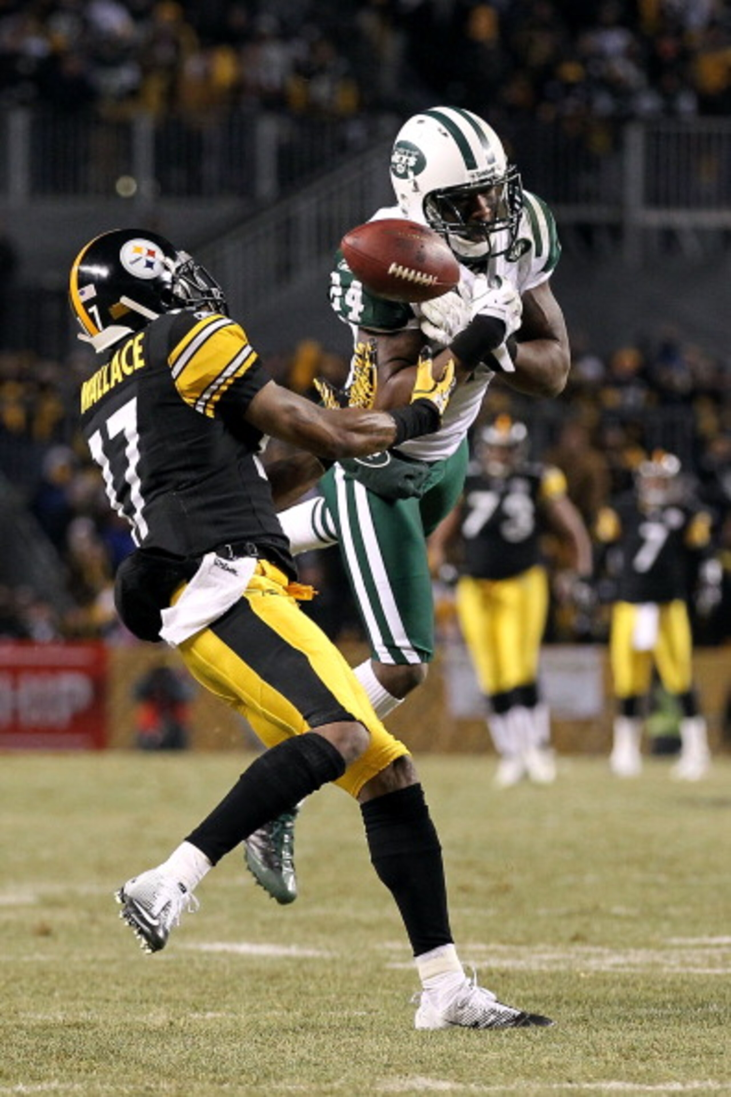 PITTSBURGH, PA - JANUARY 23:  Darrelle Revis #24 of the New York Jets breaks up a pass intended for Mike Wallace #17 of the Pittsburgh Steelers during the 2011 AFC Championship game at Heinz Field on January 23, 2011 in Pittsburgh, Pennsylvania. The Steel
