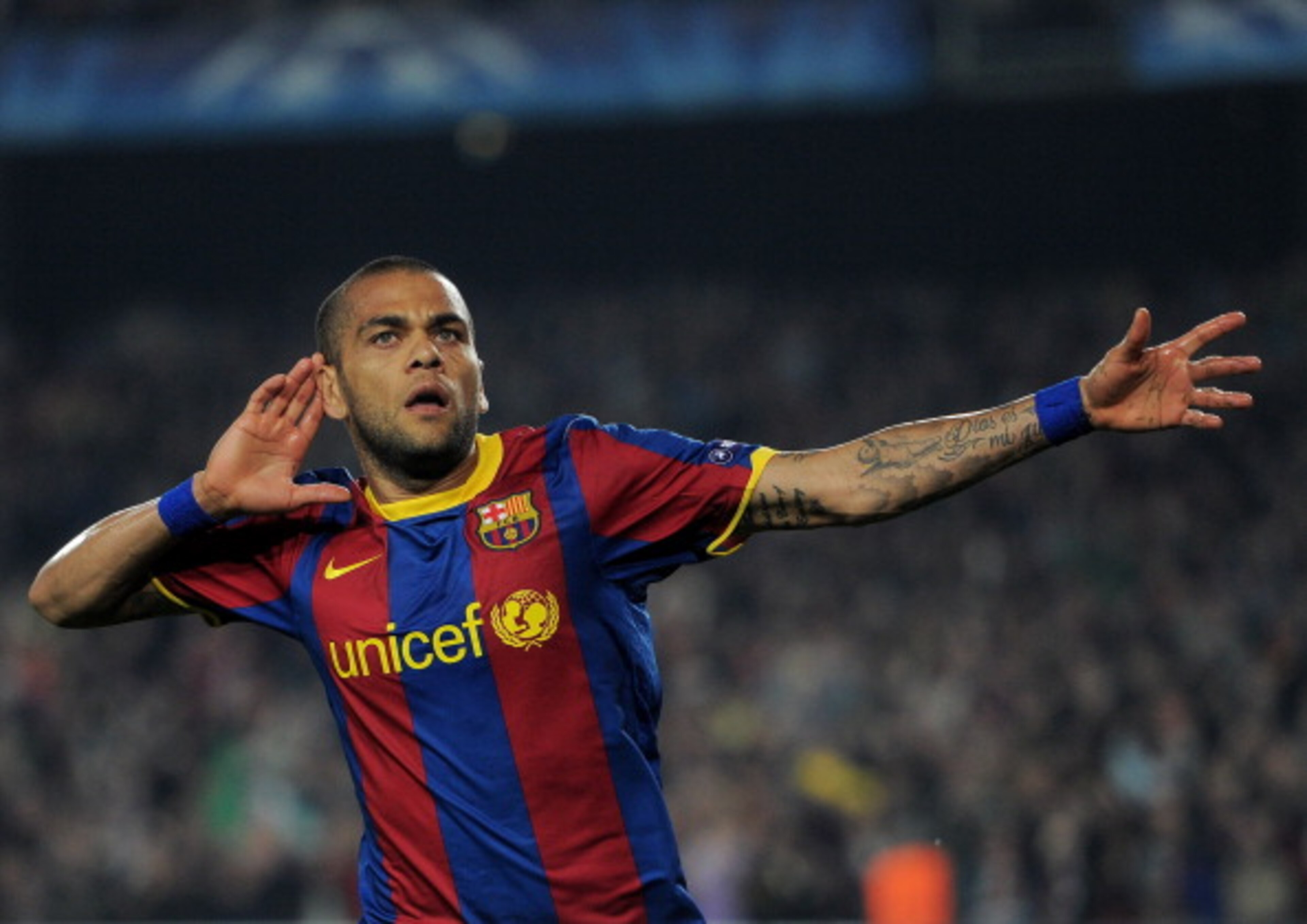 BARCELONA, SPAIN - APRIL 06:  Daniel Alves of Barcelona celebrates scoring his sides second goal during the UEFA Champions League quarter final first leg match between Barcelona and Shakhtar Donetsk at the Camp Nou stadium on April 6, 2011 in Barcelona, S