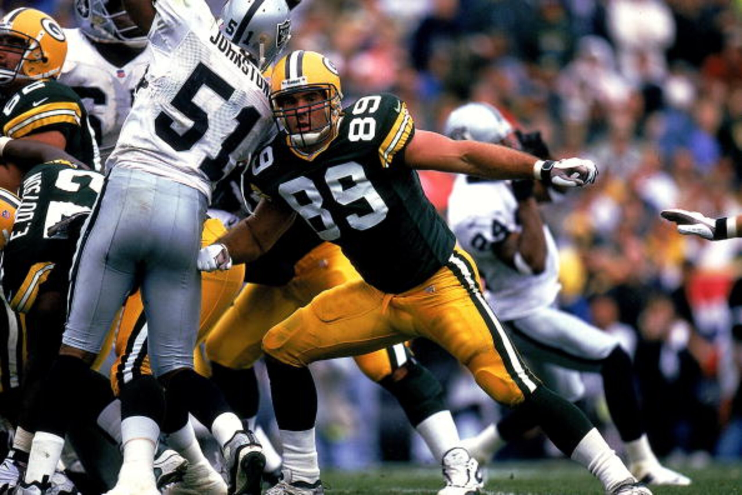 12 Sep 1999: Mark Chmura #89 of the Green Bay Packers moves to tackle during a game against the Oakland Raiders at the Lambeau Field in Green Bay, Wisconsin. The Packers defeated the Raiders 28-24.
