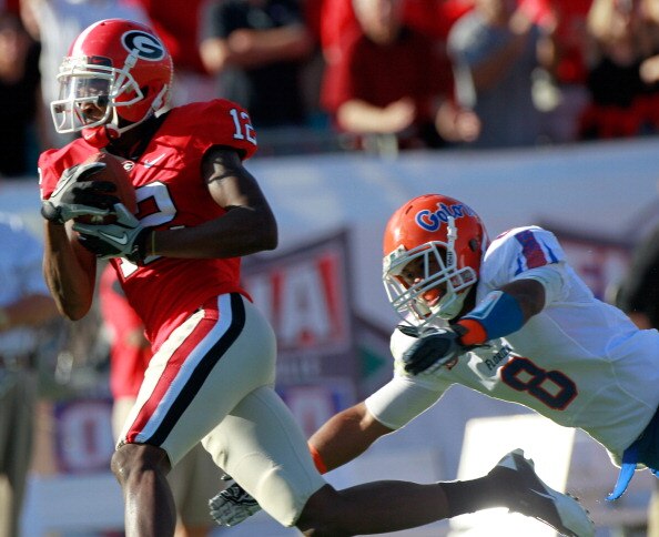 JACKSONVILLE, FL - OCTOBER 30: Jeremy Brown #8 of the Florida Gators attempts to tackle Tavarres King #12 of the Georgia Bulldogs during the game at EverBank Field on October 30, 2010 in Jacksonville, Florida. (Photo by Sam Greenwood/Getty Images) JACKSONVILLE, FL - OCTOBER 30: Jeremy Brown #8 of the Florida Gators attempts to tackle Tavarres King #12 of the Georgia Bulldogs during the game at EverBank Field on October 30, 2010 in Jacksonville, Florida. (Photo by Sam Greenwood/Getty Images)