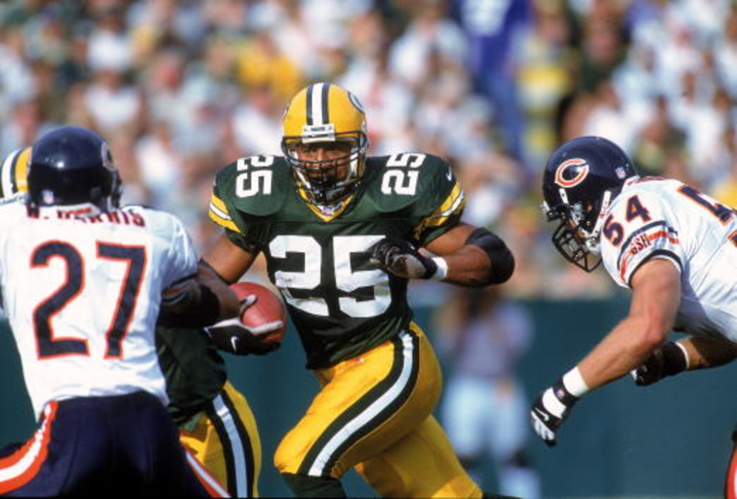 1 Oct 2000:  Dorsey Levens #25 of the Green Bay Packers carries the ball as he tries to avoid the tackle by Walt Harris #27 and Brian Urlacher #54 of the Chicago Bears at Lambeau Field in Green Bay, Wisconsin. The Bears defeated the Packers 27-24. Mandato