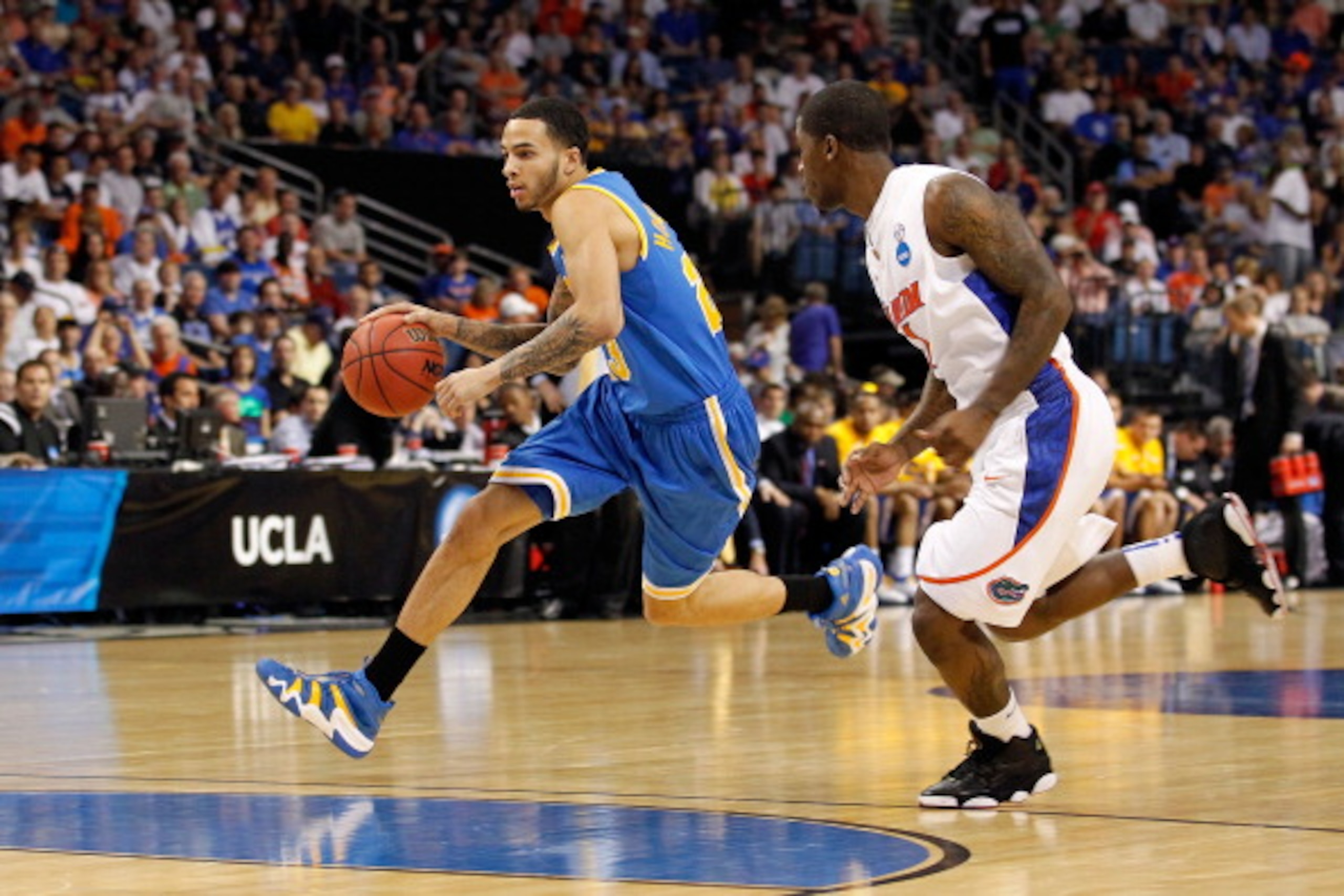TAMPA, FL - MARCH 19: Tyler Honeycutt #23 of the UCLA Bruins drives against the Florida Gators during the third round of the 2011 NCAA men's basketball tournament at St. Pete Times Forum on March 19, 2011 in Tampa, Florida. (Photo by J. Meric/Getty Imag TAMPA, FL - MARCH 19: Tyler Honeycutt #23 of the UCLA Bruins drives against the Florida Gators during the third round of the 2011 NCAA men's basketball tournament at St. Pete Times Forum on March 19, 2011 in Tampa, Florida. (Photo by J. Meric/Getty Imag