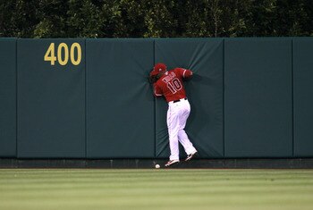 ANAHEIM, CA - JUNE 7: Center fielder Vernon Wells #10 of the Los Angeles Angels of Anaheim can't catch an RBI double hit by Johnny Damon of the Tampa Bay Rays in the fourth inning on June 7, 2011 at Angel Stadium in Anaheim, California. (Photo by Stephe ANAHEIM, CA - JUNE 7: Center fielder Vernon Wells #10 of the Los Angeles Angels of Anaheim can't catch an RBI double hit by Johnny Damon of the Tampa Bay Rays in the fourth inning on June 7, 2011 at Angel Stadium in Anaheim, California. (Photo by Stephe