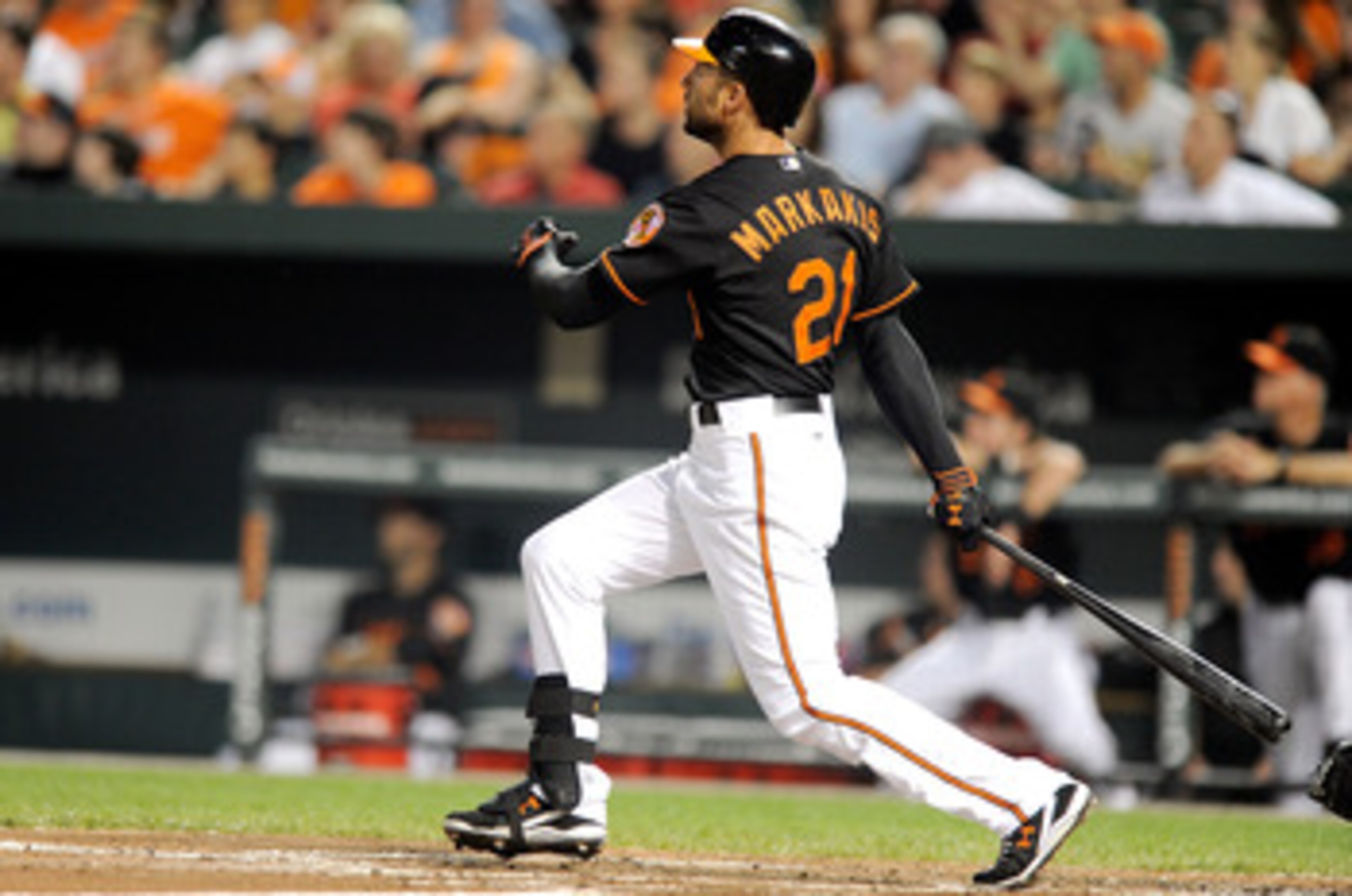 BALTIMORE, MD - JUNE 10:  Nick Markakis #21 of the Baltimore Orioles hits a grand slam in the second inning against the Tampa Bay Rays at Oriole Park at Camden Yards on June 10, 2011 in Baltimore, Maryland.  (Photo by Greg Fiume/Getty Images)