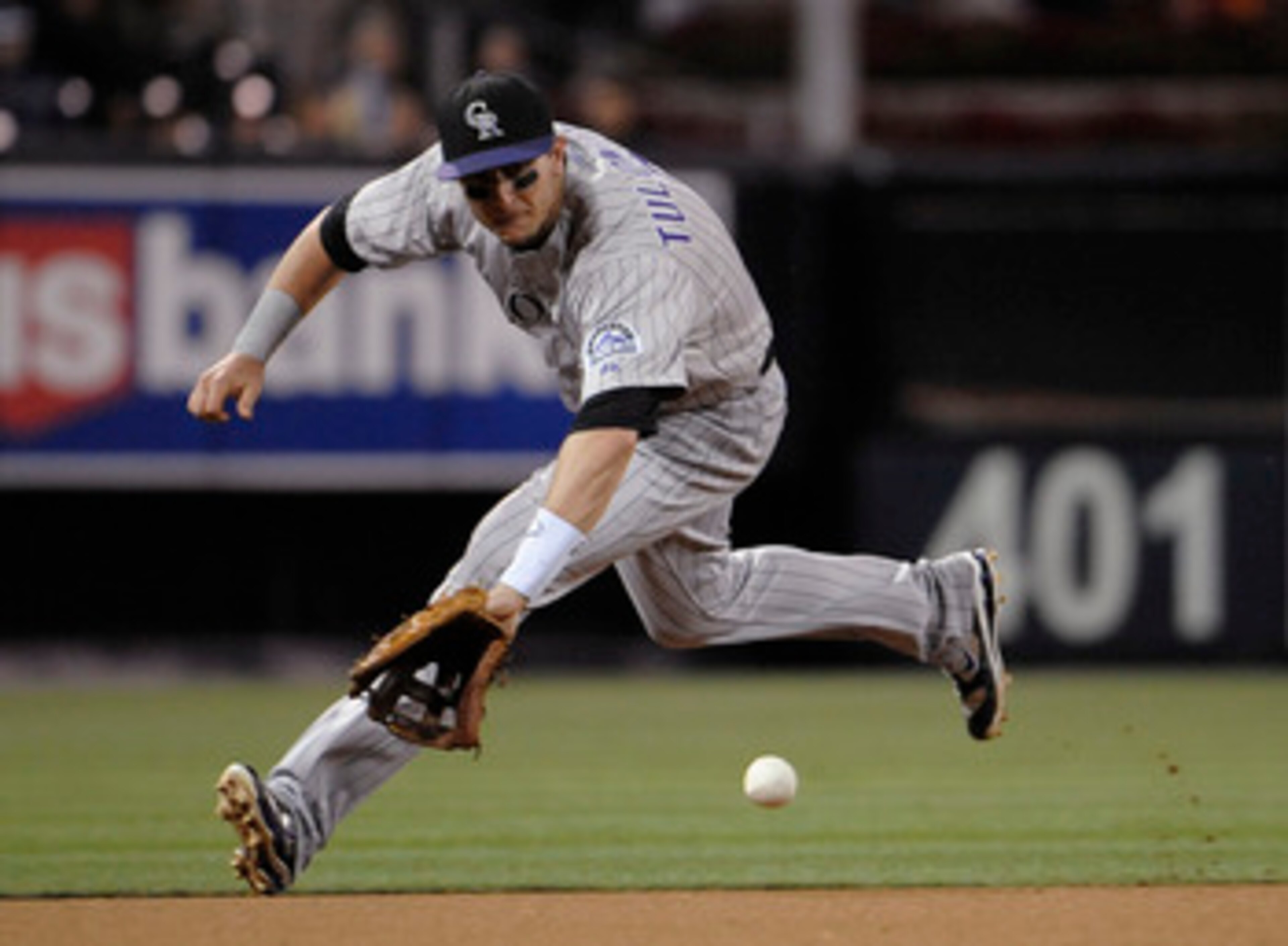 SAN DIEGO, CA - JUNE 6: Troy Tulowitzki #2 of the Colorado Rockies makes the stop on a ground ball hit by Jorge Cantu #3 of the San Diego Padres during the sixth inning of a baseball game Petco Park on June 6, 2011 in San Diego, California.  Tulowitzki go