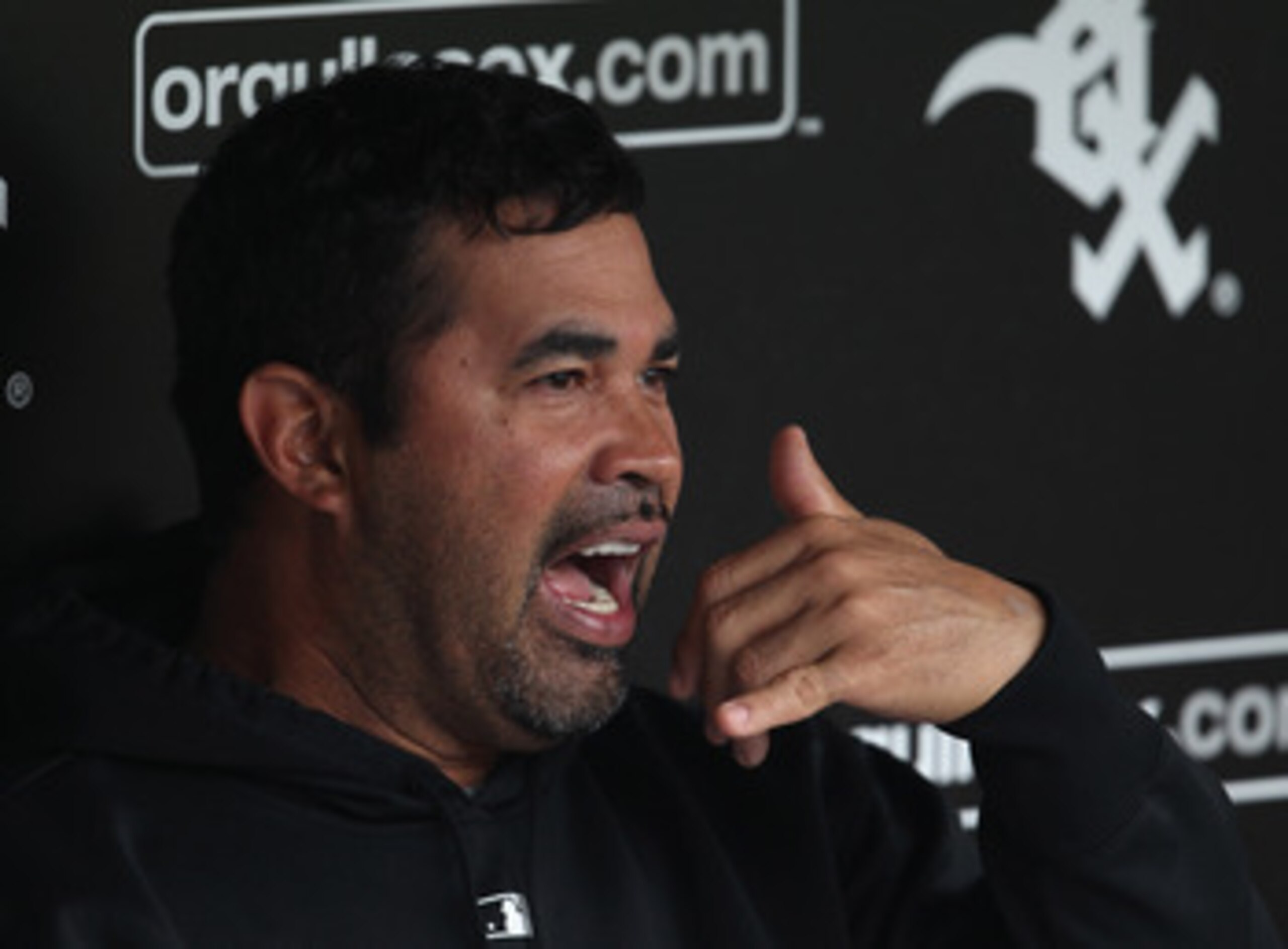 CHICAGO, IL - JUNE 09:  Manager Ozzie Guillen #13 of the Chicago White Sox talks with reporters before a game against the Oakland Athletics at U.S. Cellular Field on June 9, 2011 in Chicago, Illinois.  (Photo by Jonathan Daniel/Getty Images)