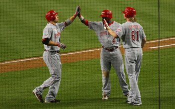 LOS ANGELES, CA - JUNE 13: Joe Votto #19 of the Cincinnati Reds high fives with teammates Brandon Phillips #4 and Brandon Arroyo #61 after hitting a three-run home run in the seventh inning against the Los Angeles Dodgers during the MLB game at Dodger St LOS ANGELES, CA - JUNE 13: Joe Votto #19 of the Cincinnati Reds high fives with teammates Brandon Phillips #4 and Brandon Arroyo #61 after hitting a three-run home run in the seventh inning against the Los Angeles Dodgers during the MLB game at Dodger St