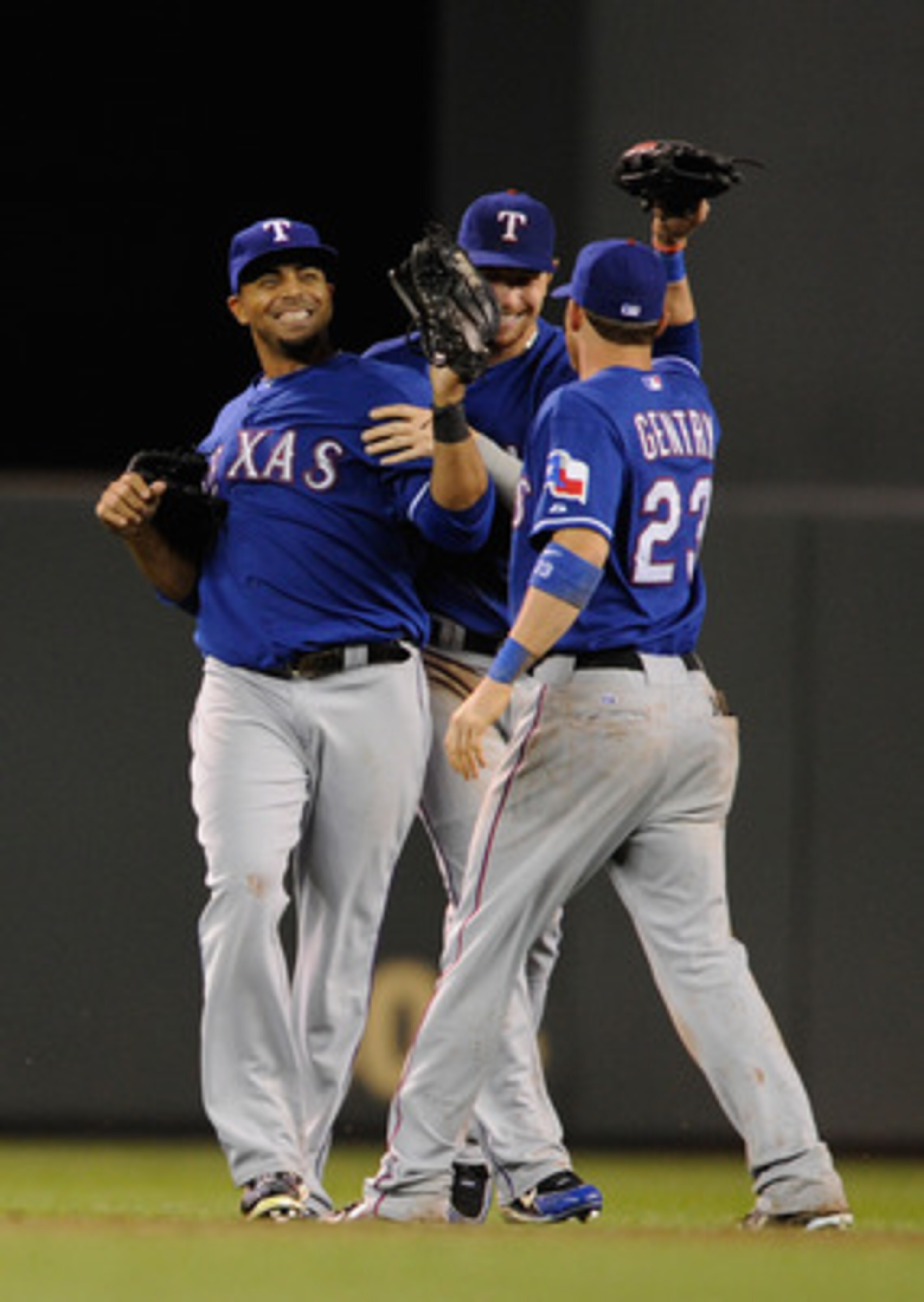 MINNEAPOLIS, MN - JUNE 10: Nelson Cruz #17 (L), Josh Hamilton #32 and Craig Gentry #23 of the Texas Rangers celebrate a win against the Minnesota Twins following their game on June 10, 2011 at Target Field in Minneapolis, Minnesota. The Rangers defeated t