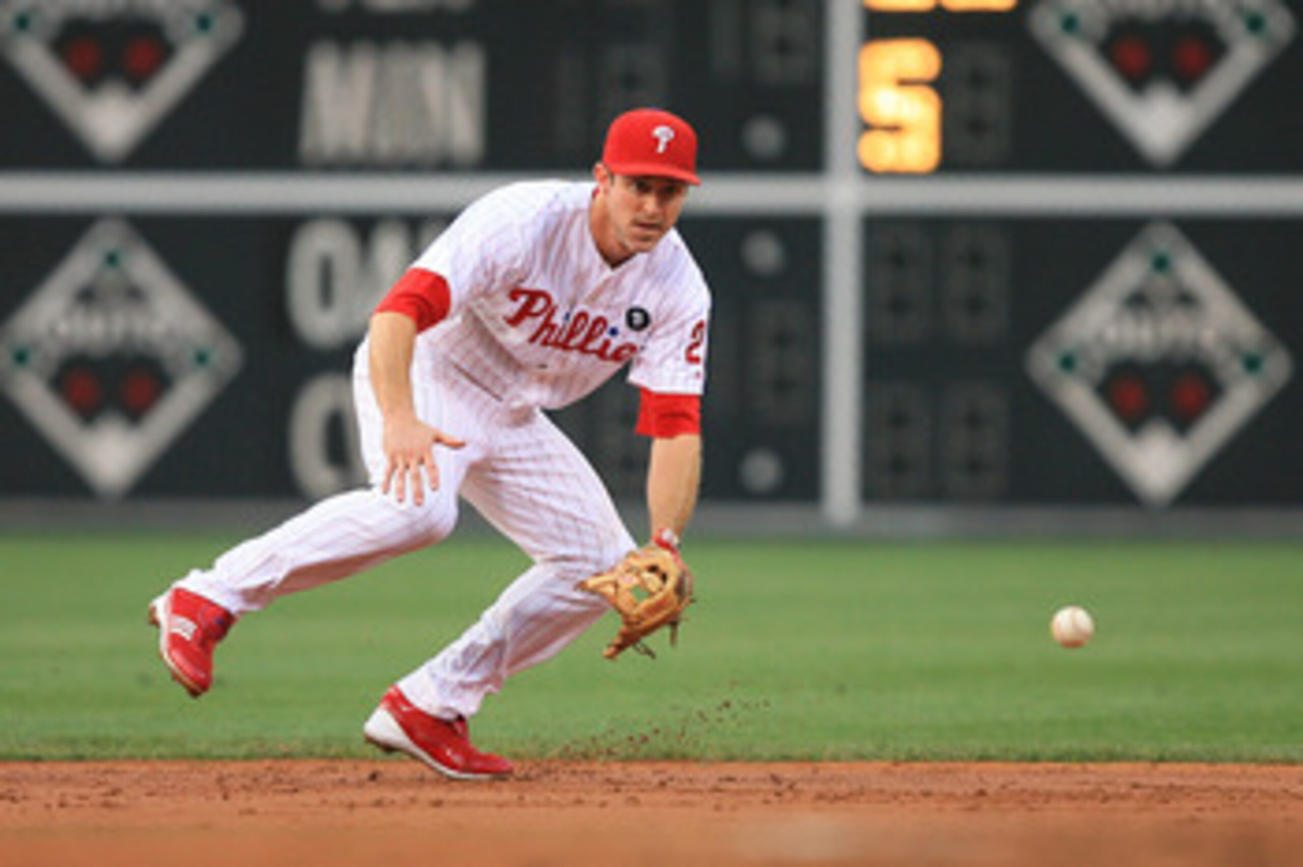 PHILADELPHIA - JUNE 10: Second baseman Chase Utley #26 of the Philadelphia Phillies fields a ground ball during a game against the Chicago Cubs at Citizens Bank Park on June 10, 2011 in Philadelphia, Pennsylvania. The Phillies won 7-5. (Photo by Hunter Ma