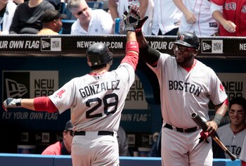 TORONTO, CANADA - JUNE 12: Adrian Gonzalez #28 and David Ortiz #34 of the Boston Red Sox celebrate a home run during MLB action against the Toronto Blue Jays at The Rogers Centre June 12, 2011 in Toronto, Ontario, Canada. (Photo by Abelimages/Getty Image TORONTO, CANADA - JUNE 12: Adrian Gonzalez #28 and David Ortiz #34 of the Boston Red Sox celebrate a home run during MLB action against the Toronto Blue Jays at The Rogers Centre June 12, 2011 in Toronto, Ontario, Canada. (Photo by Abelimages/Getty Image