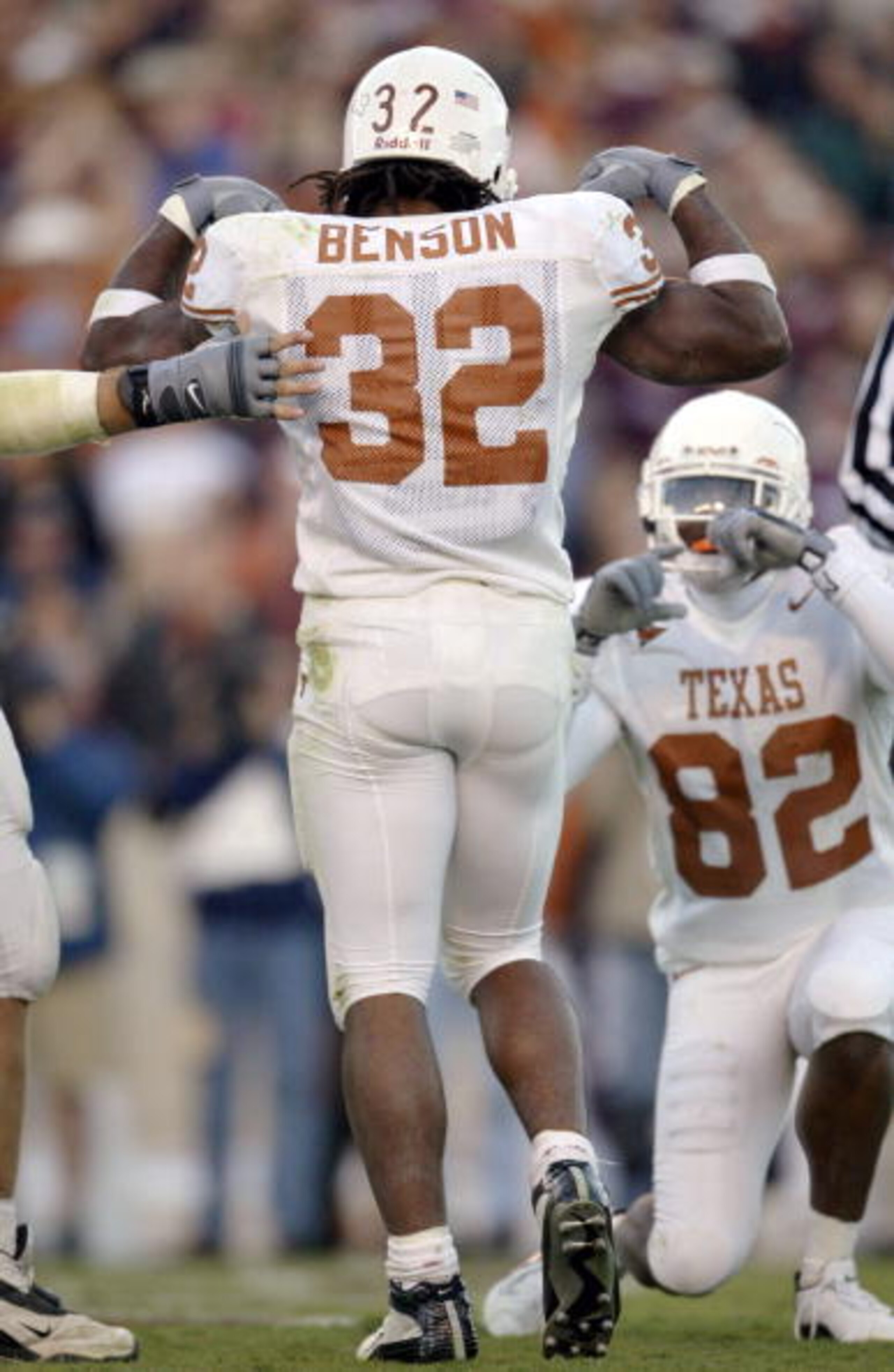 CORRECTED: COLLEGE STATION, TX - NOVEMBER 28:  Running back Cedric Benson #32 of the Texas Longhorns flexes his biceps and poses after a touchdown as B.J. Johnson #82 pretends to take his picture against the Texas A&M Aggies in the third quarter November