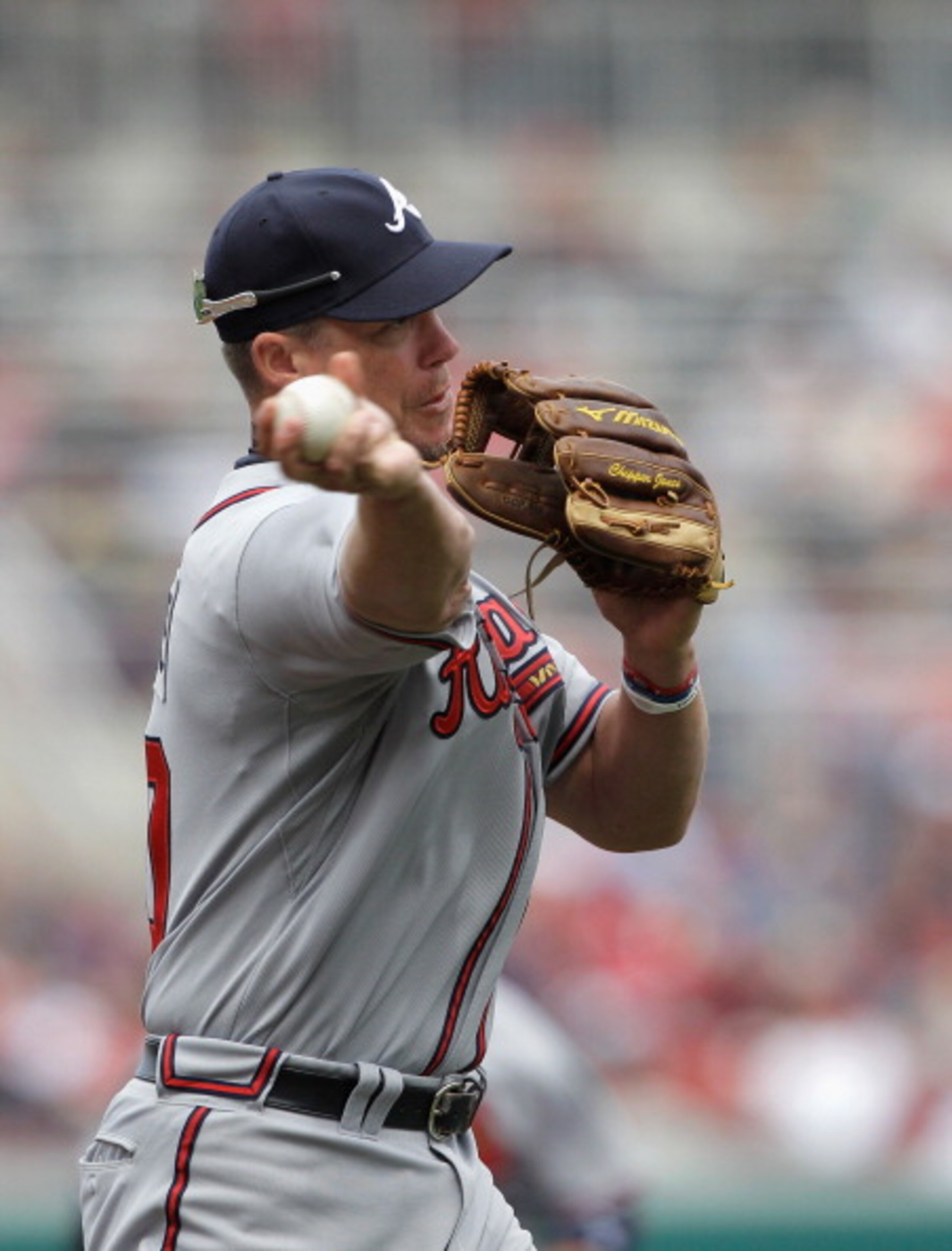 WASHINGTON, DC - APRIL 03:  Third baseman Chipper Jones #10 of the Atlanta Braves makes a throw against the Washington Nationals at Nationals Park on April 3, 2011 in Washington, DC.  (Photo by Rob Carr/Getty Images)