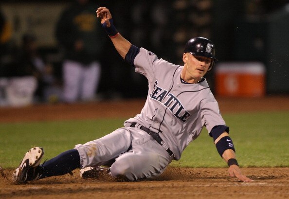 OAKLAND, CA - APRIL 02:  Brendan Ryan #26 of the Seattle Mariners scores on a sacrafice fly hit by Michael Saunders in the seventh inning against the Oakland Athletics during a Major League Baseball game at the Oakland-Alameda County Coliseum on April 2,