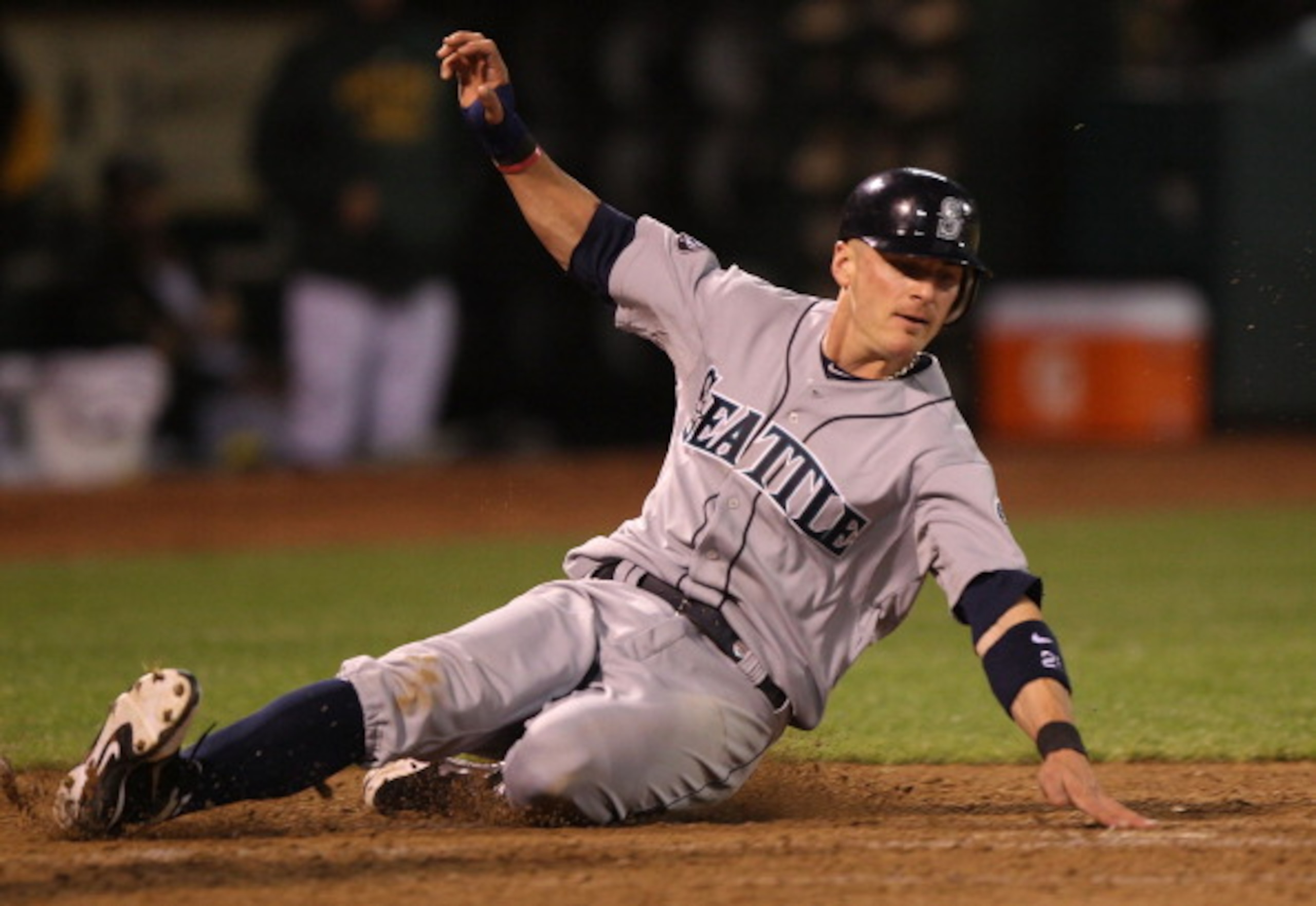 OAKLAND, CA - APRIL 02:  Brendan Ryan #26 of the Seattle Mariners scores on a sacrafice fly hit by Michael Saunders in the seventh inning against the Oakland Athletics during a Major League Baseball game at the Oakland-Alameda County Coliseum on April 2,