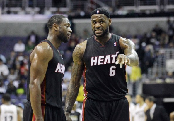 WASHINGTON, DC - MARCH 30: Dwyane Wade #3 and LeBron James #6 of the Miami Heat confer during the second half against the Washington Wizards at the Verizon Center on March 30, 2011 in Washington, DC. NOTE TO USER: User expressly acknowledges and agrees th