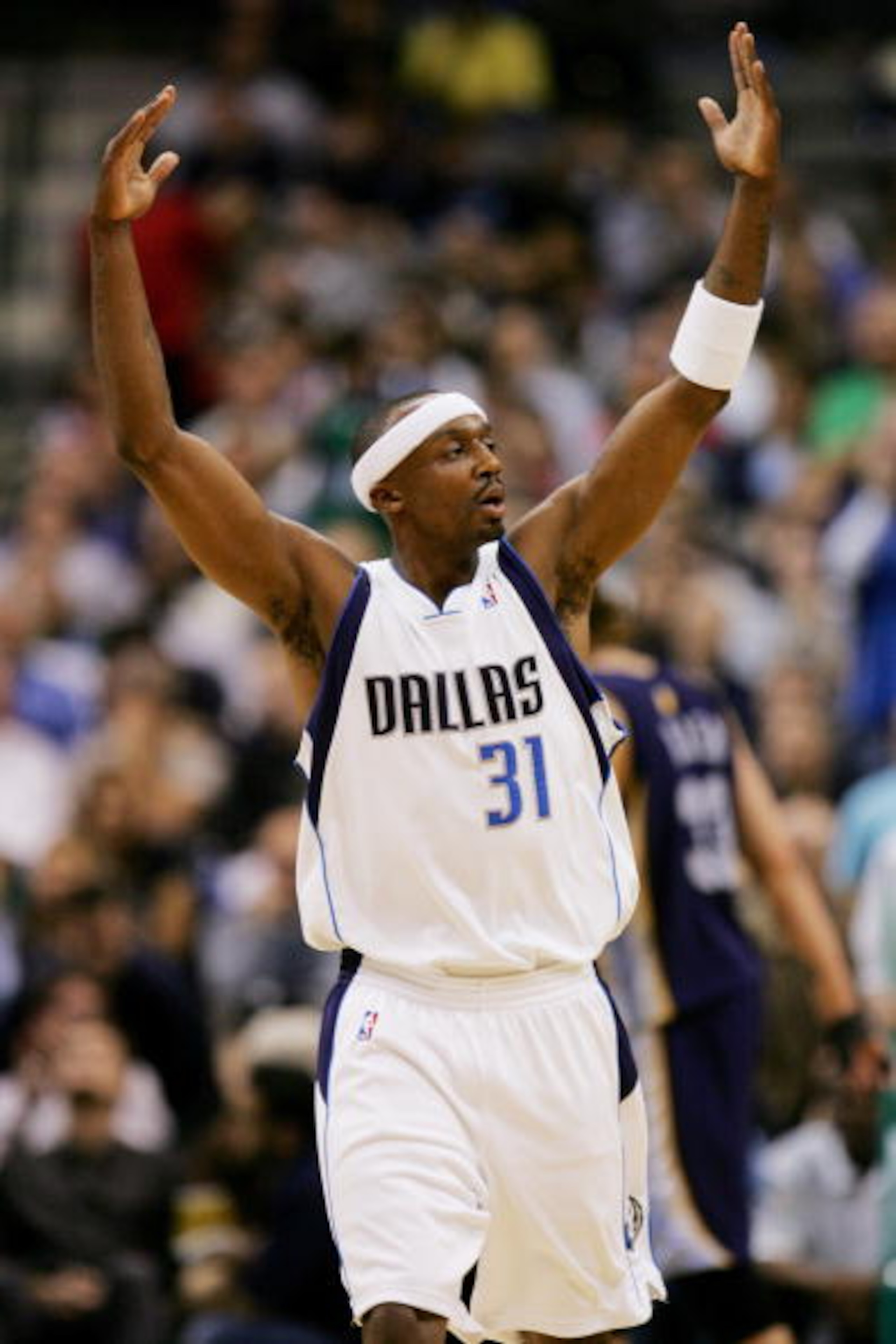 DALLAS - FEBRUARY 7:  Jason Terry #31 of the Dallas Mavericks raises his arms against the Memphis Grizzlies on February 7, 2007 at American Airlines Center in Dallas, Texas. The Mavs won 113-97.  NOTE TO USER: User expressly acknowledges and agrees that,