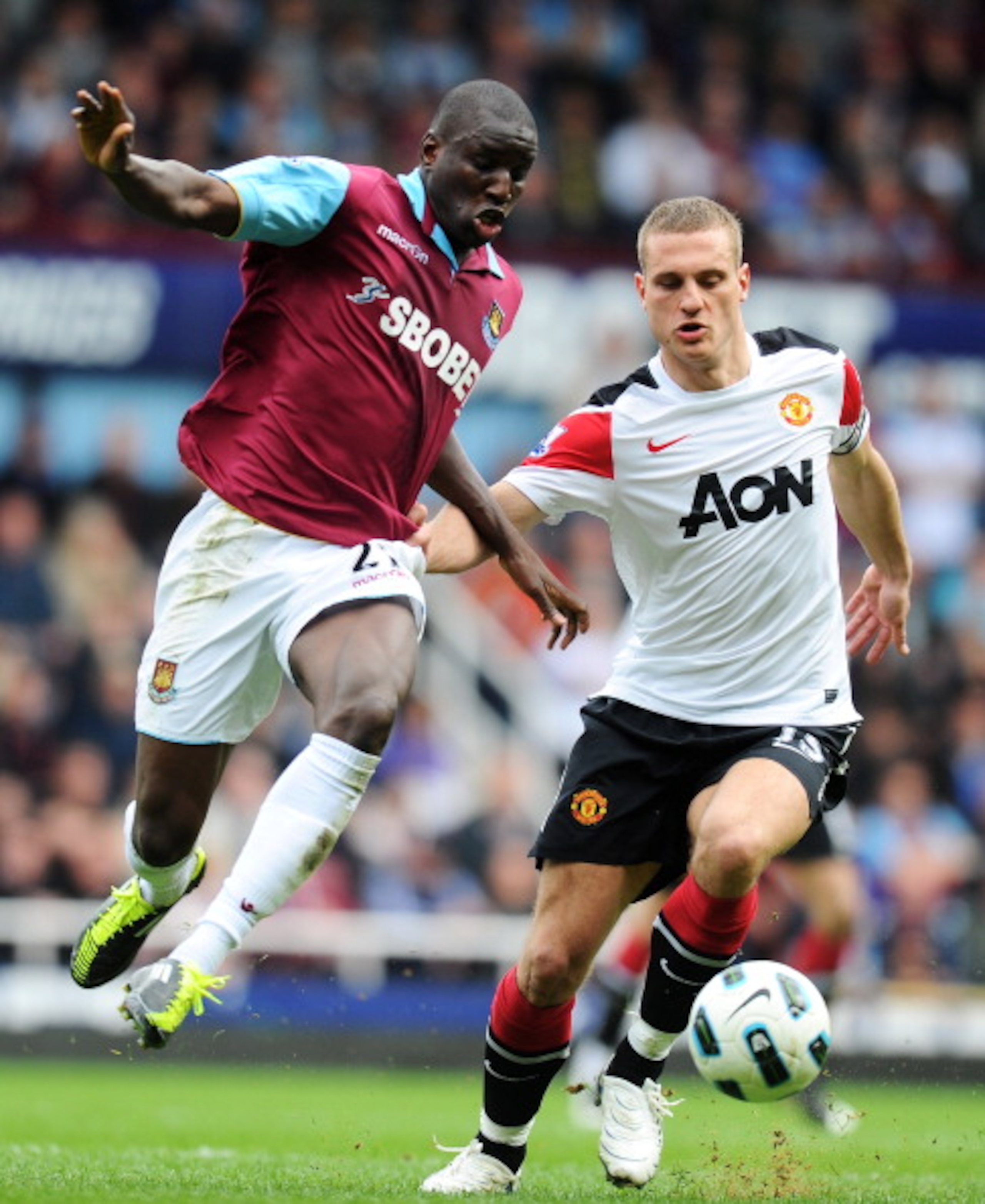 LONDON, ENGLAND - APRIL 02:  Nemanja Vidic of Manchester United challenges Demba Ba of West Ham United during the Barclays Premier League match between West Ham United and Manchester United at the Boleyn Ground on April 2, 2011 in London, England.  (Photo