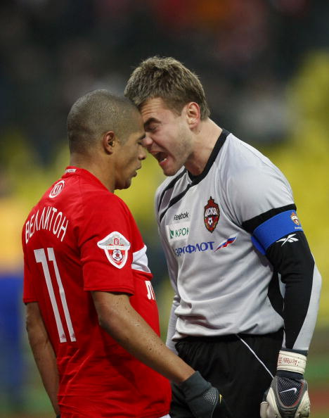 MOSCOW,  RUSSIA - NOVEMDER 21: Velliton (L) of FC Spartak Moscow  and Igor Akinfeev (R) of FC CSKA Moscow clash during the Russian Football League Championship match between FC Spartak and  FC CSKA at the Luzhniki Stadium on November 21, 2009 in Moscow, R