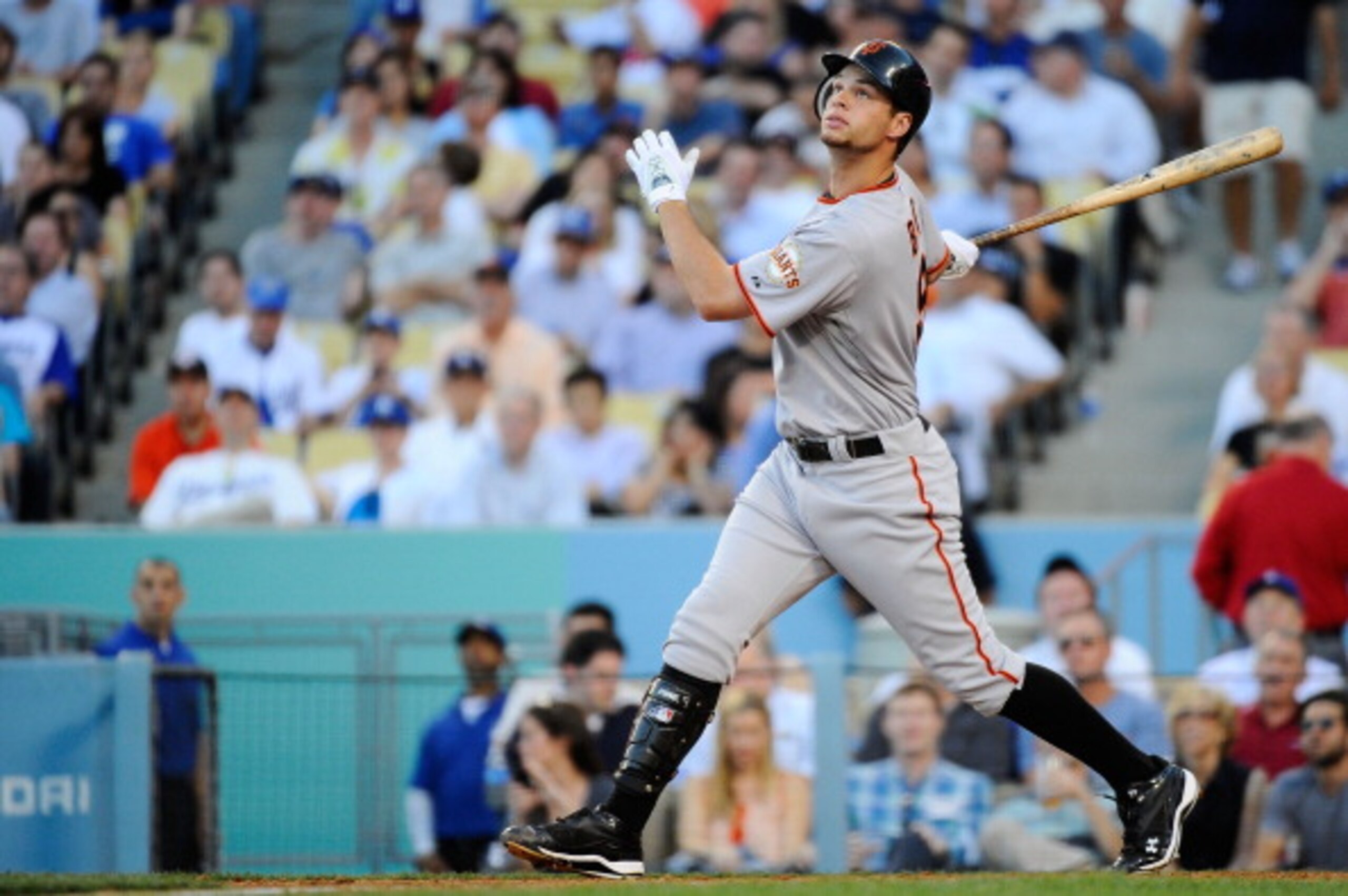 LOS ANGELES, CA - MARCH 31:  Brandon Belt #9 of the San Francisco Giants swings during an at bat against the Los Angeles Dodgers on Opening Day at Dodger Stadium on March 31, 2011 in Los Angeles, California.  (Photo by Kevork Djansezian/Getty Images)