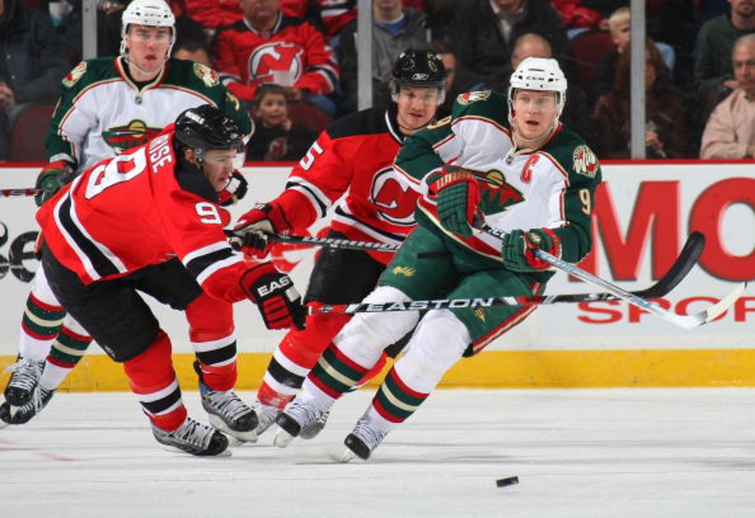 NEWARK, NJ - MARCH 20: Mikko Koivu #9 of the Minnesota Wild skates against Zach Parise #9 of the New Jersey Devils on March 20, 2009 at the Prudential Center in Newark, New Jersey. (Photo by Bruce Bennett/Getty Images)