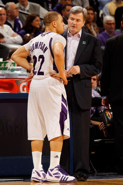 INDIANAPOLIS - MARCH 11:  Head coach Bill Carmody of the Northwestern Wildcats speaks with guard Michael Thompson #22 during the game against the Indiana Hoosiers in the first round of the Big Ten Men's Basketball Tournament at Conseco Fieldhouse on March