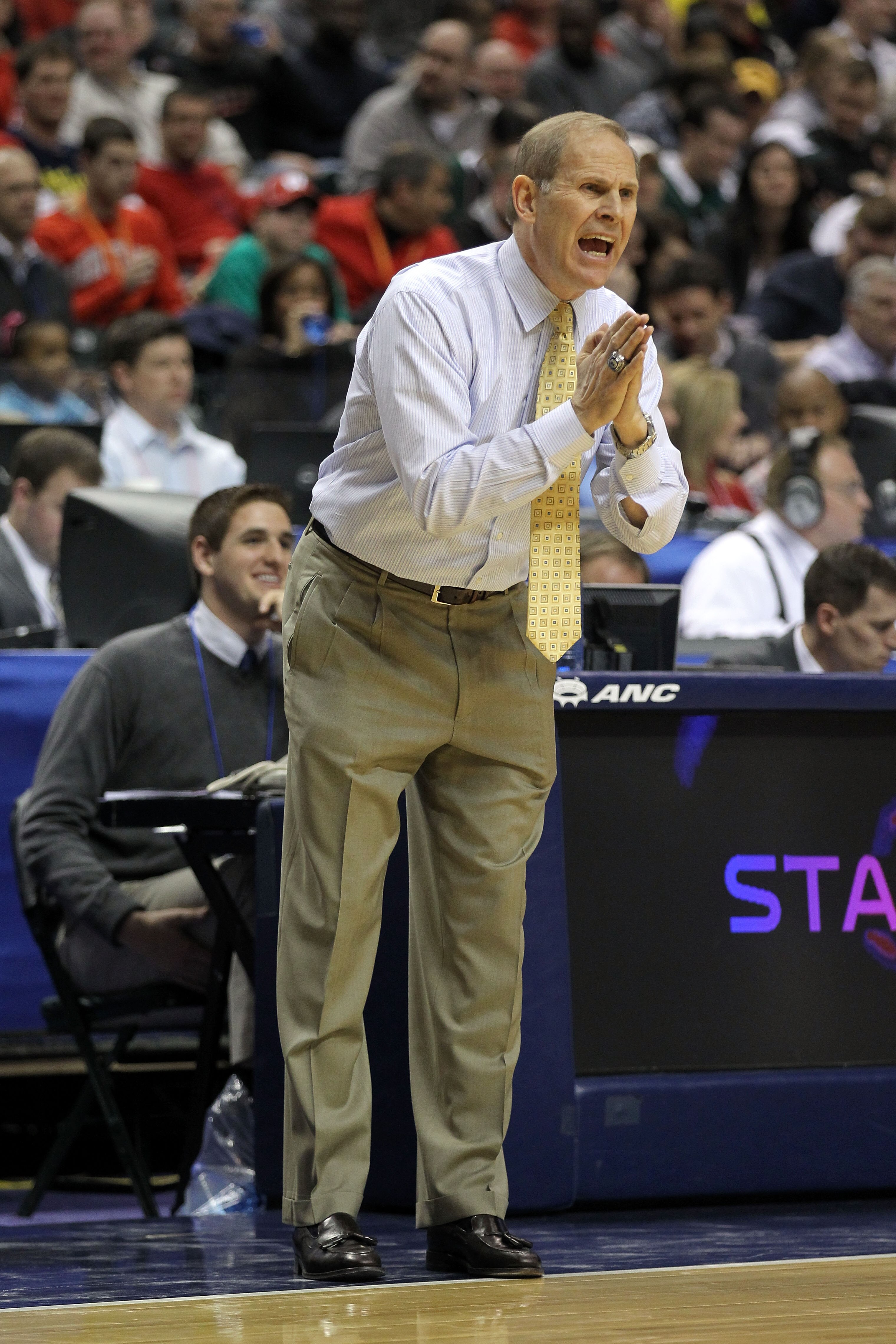 INDIANAPOLIS, IN - MARCH 12:  Head coach John Beilein of the Michigan Wolverines reacts as he coaches against the Ohio State Buckeyes during the semifinals of the 2011 Big Ten Men's Basketball Tournament at Conseco Fieldhouse on March 12, 2011 in Indianap