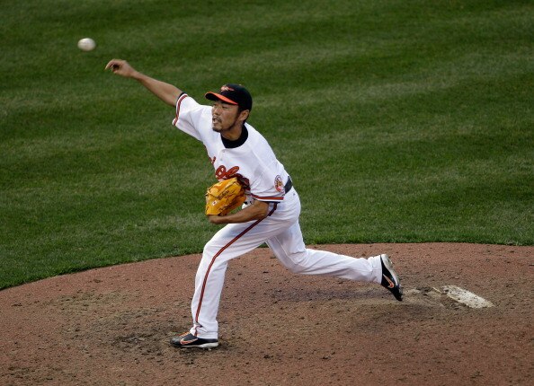 BALTIMORE, MD - APRIL 04:  Reliever Koji Uehara #19 of the Baltimore Orioles delivers to a Detroit Tigers batter during the ninth inning during opening day at Oriole Park at Camden Yards on April 4, 2011 in Baltimore, Maryland.  (Photo by Rob Carr/Getty I