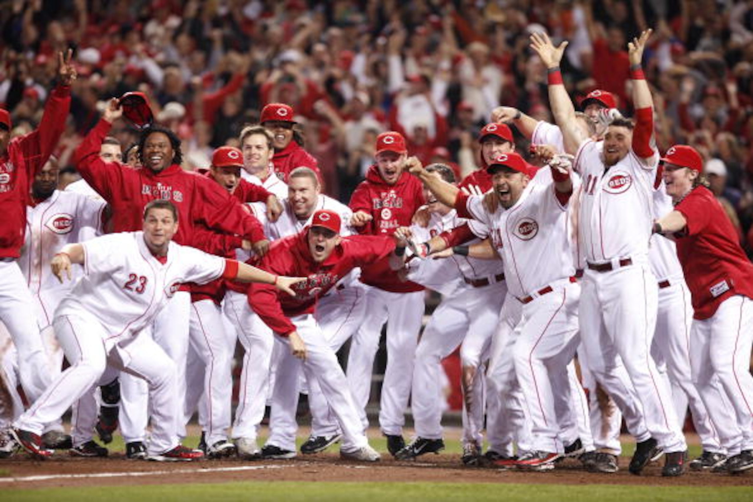 CINCINNATI, OH - SEPTEMBER 28: The Cincinnati Reds celebrate Jay Bruce's walk off home run against the Houston Astros at Great American Ball Park on September 28, 2010 in Cincinnati, Ohio. The Reds won 3-2 to clinch the NL Central Division title. (Photo b CINCINNATI, OH - SEPTEMBER 28: The Cincinnati Reds celebrate Jay Bruce's walk off home run against the Houston Astros at Great American Ball Park on September 28, 2010 in Cincinnati, Ohio. The Reds won 3-2 to clinch the NL Central Division title. (Photo b
