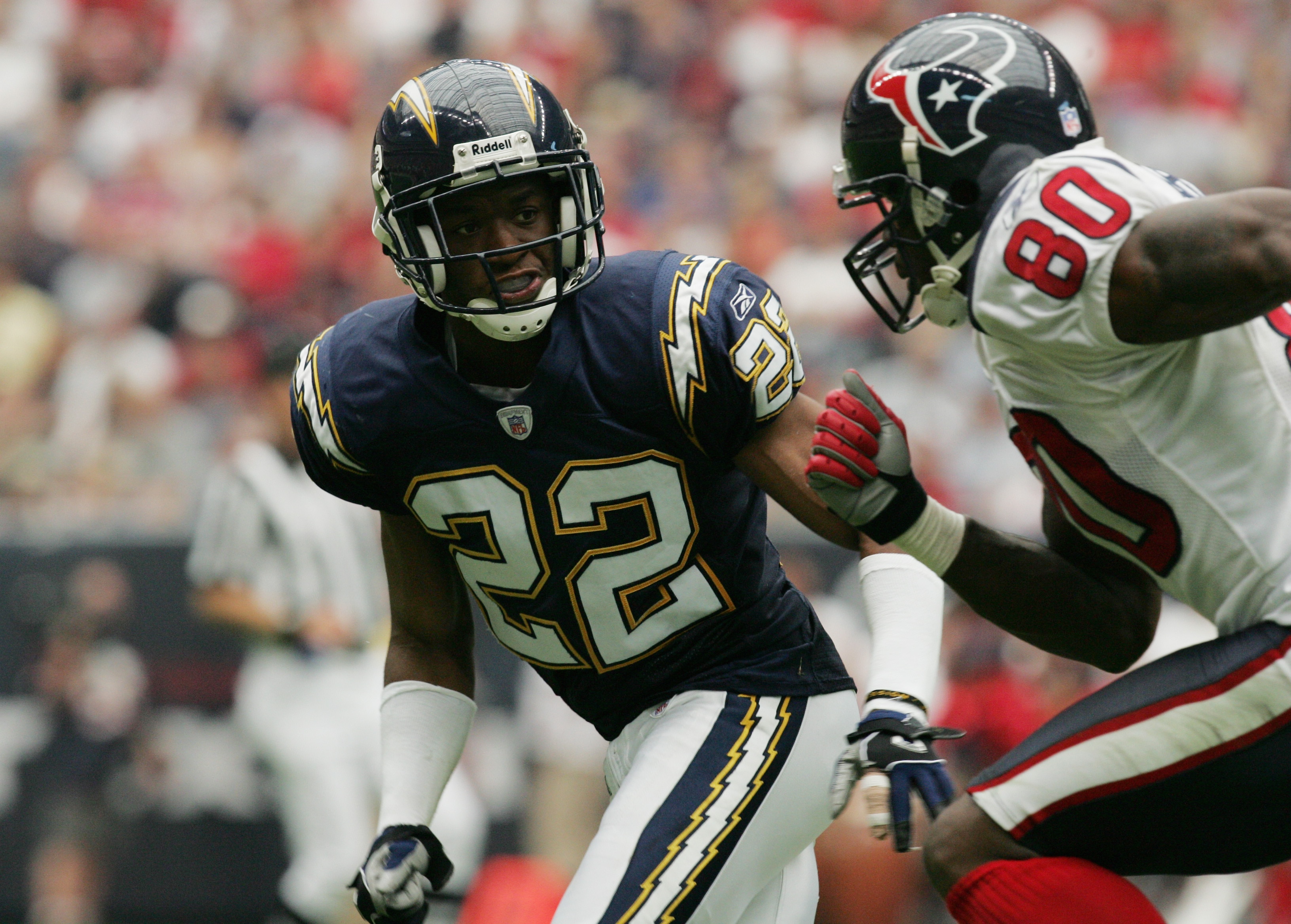 HOUSTON - SEPTEMBER 12:  Sammy Davis #22 of the San Diego Chargers covers Andre Johnson #80 of the Houston Texans on September 12, 2004 at Reliant Stadium in Houston, Texas. The Chargers won 27-20.  (Photo by Ronald Martinez/Getty Images)