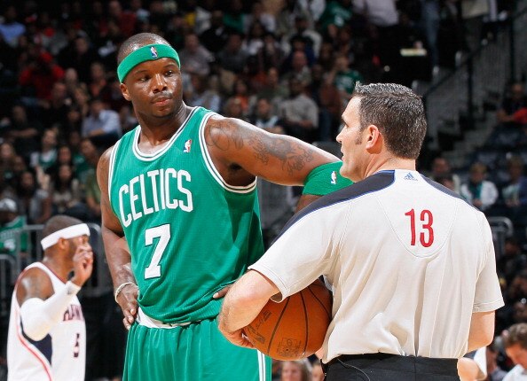 ATLANTA, GA - APRIL 01:  Jermaine O'Neal #7 of the Boston Celtics converses with referee Monty McCutchen #13 against the Atlanta Hawks at Philips Arena on April 1, 2011 in Atlanta, Georgia.  NOTE TO USER: User expressly acknowledges and agrees that, by do
