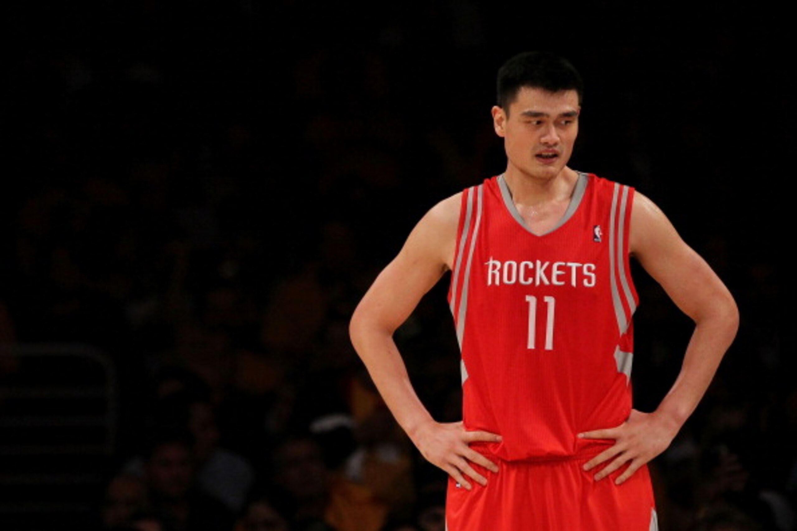 LOS ANGELES, CA - OCTOBER 26:  Yao Ming #11 of the Houston Rockets looks on during their opening night game against the Los Angeles Lakers at Staples Center on October 26, 2010 in Los Angeles, California. NOTE TO USER: User expressly acknowledges and agre
