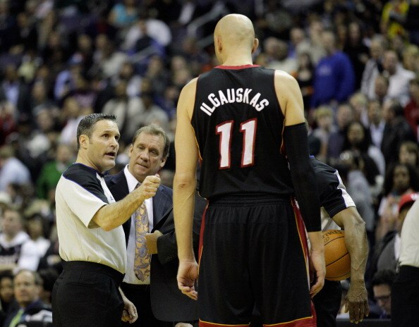 WASHINGTON, DC - MARCH 30: Referee Monty McCutchen #13 ejects Zydrunas Ilgauskas #11 of the Miami Heat after an altercation with John Wall #2 of the Washington Wizards during the first half at the Verizon Center on March 30, 2011 in Washington, DC. NOTE T