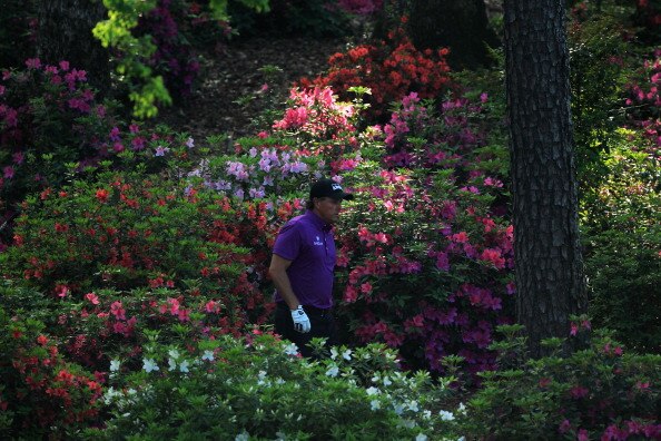 AUGUSTA, GA - APRIL 07:  Phil Mickelson plays his second shot from the flowers on the 13th hole during the first round of the 2011 Masters Tournament at Augusta National Golf Club on April 7, 2011 in Augusta, Georgia.  (Photo by David Cannon/Getty Images)