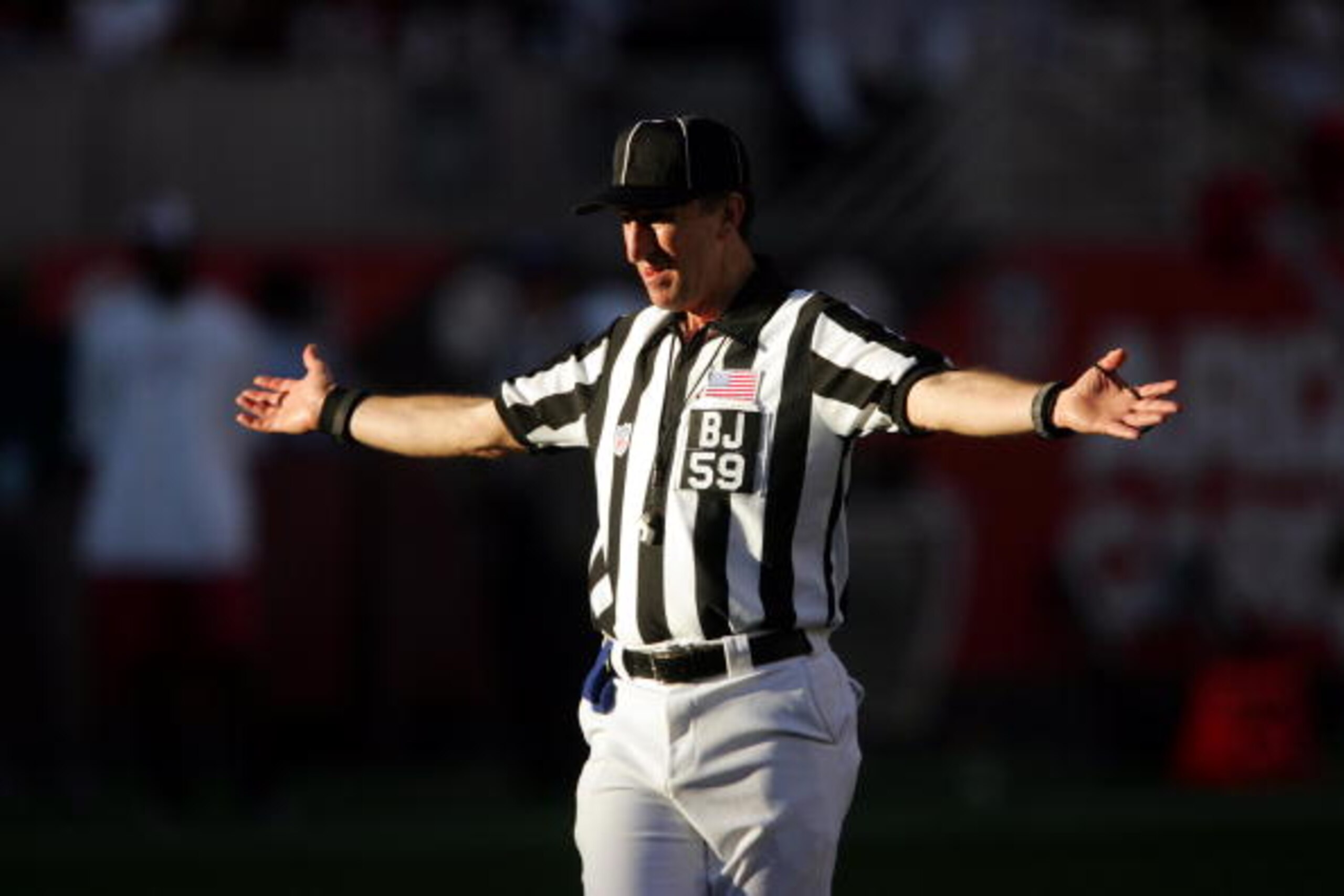 SAN DIEGO, CA - DECEMBER 12:  Back judge Phil Luckett #59 makes a call during the game between the Arizona Cardinals and the San Francisco 49ers on December 12, 2004 at Sun Devil Stadium in Tempe, Arizona.  The 49ers won in overtime 31-28.  (Photo by Step