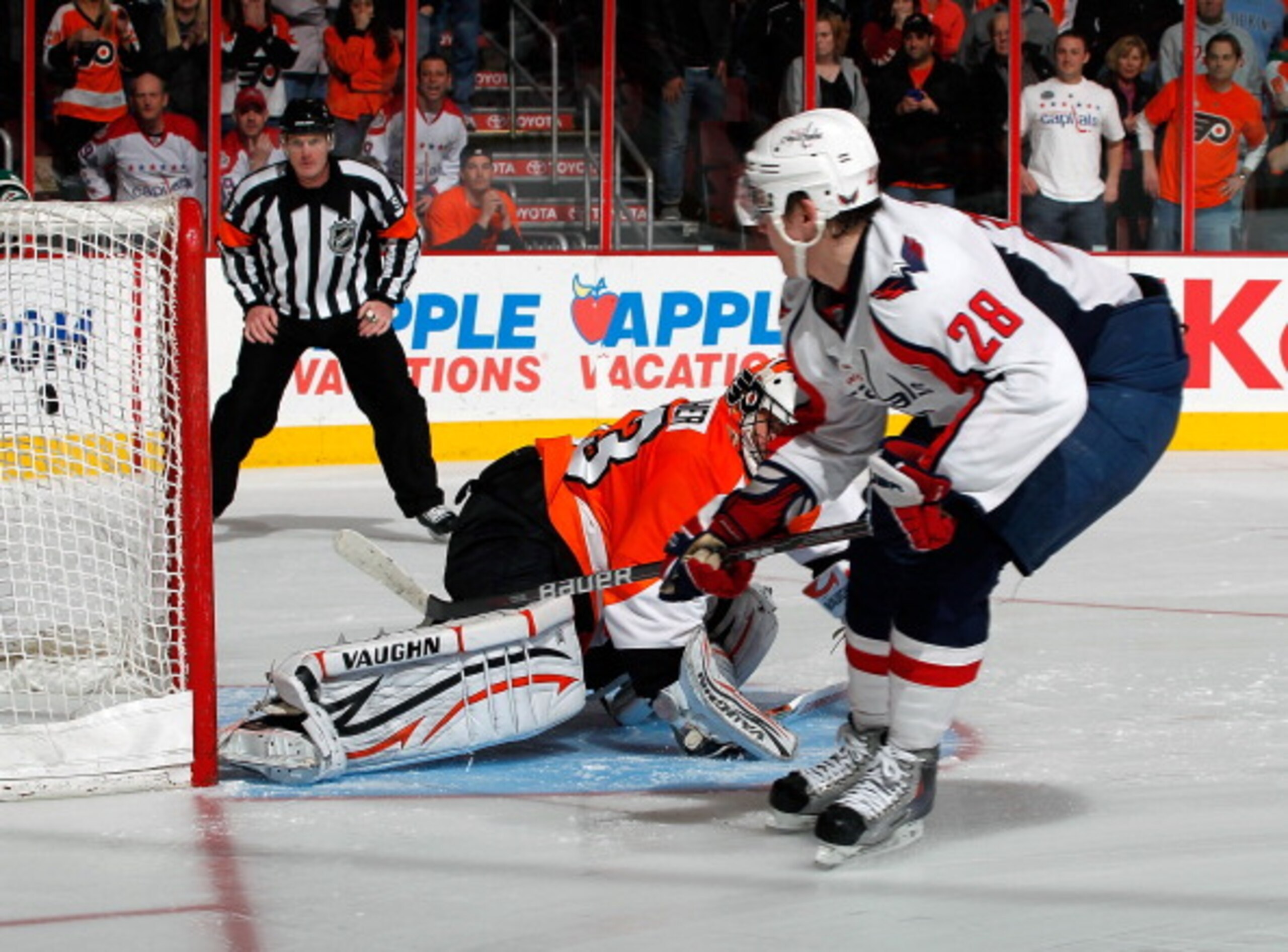 PHILADELPHIA, PA - MARCH 22:  Alexander Semin #28 of the Washington Capitals shoots the puck past goalie Brian Boucher #33 of the Philadelphia Flyers for the winning goal in the shootout in an NHL hockey game at the Wells Fargo Center on March 22, 2011 in