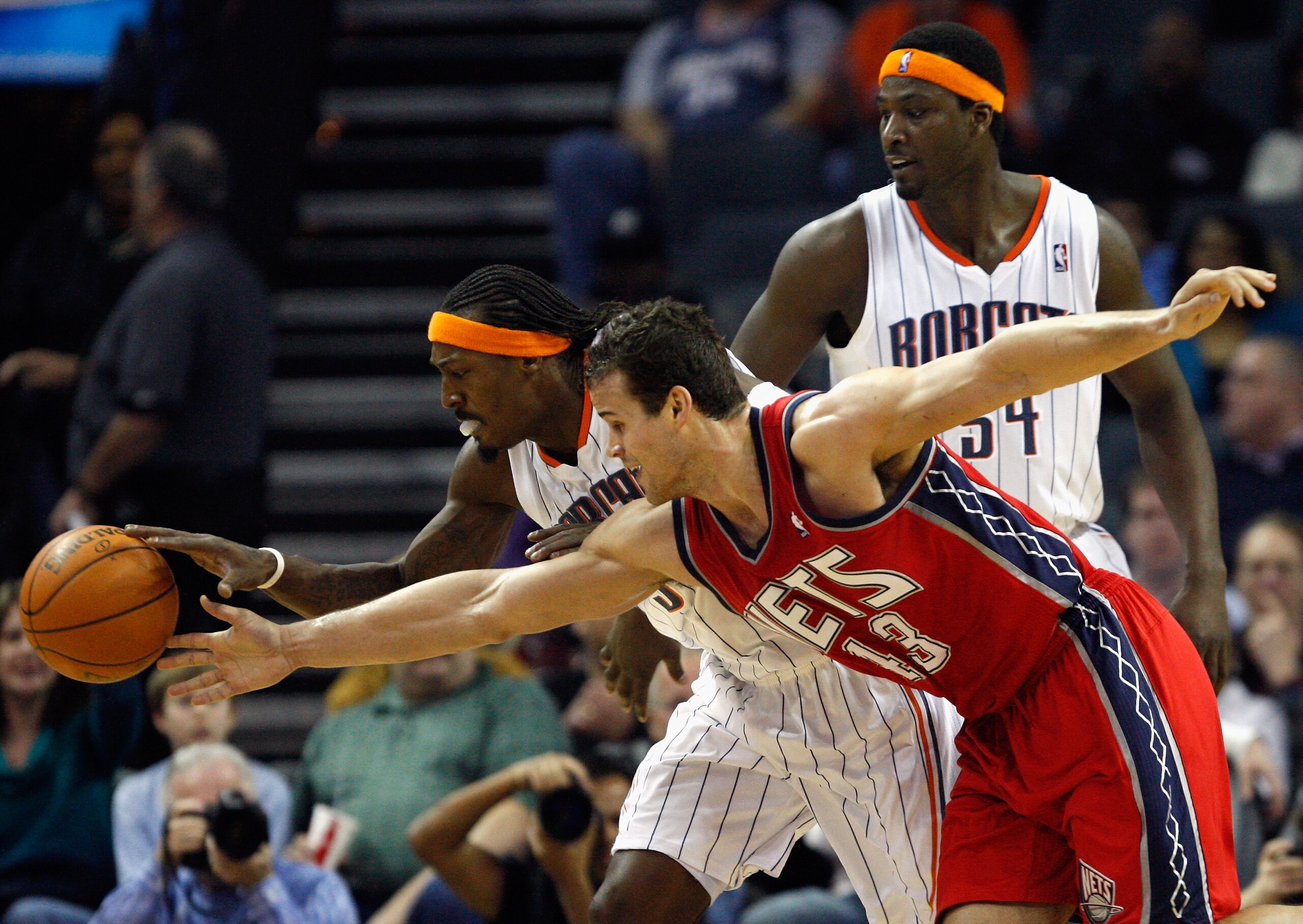 CHARLOTTE, NC - FEBRUARY 11: Kris Humphries #43 of the New Jersey Nets battles for a loose ball with teammates Kwame Brown #54 and Gerald Wallace #3 of the Charlotte Bobcats during their game at Time Warner Cable Arena on February 11, 2011 in Charlotte, CHARLOTTE, NC - FEBRUARY 11: Kris Humphries #43 of the New Jersey Nets battles for a loose ball with teammates Kwame Brown #54 and Gerald Wallace #3 of the Charlotte Bobcats during their game at Time Warner Cable Arena on February 11, 2011 in Charlotte,