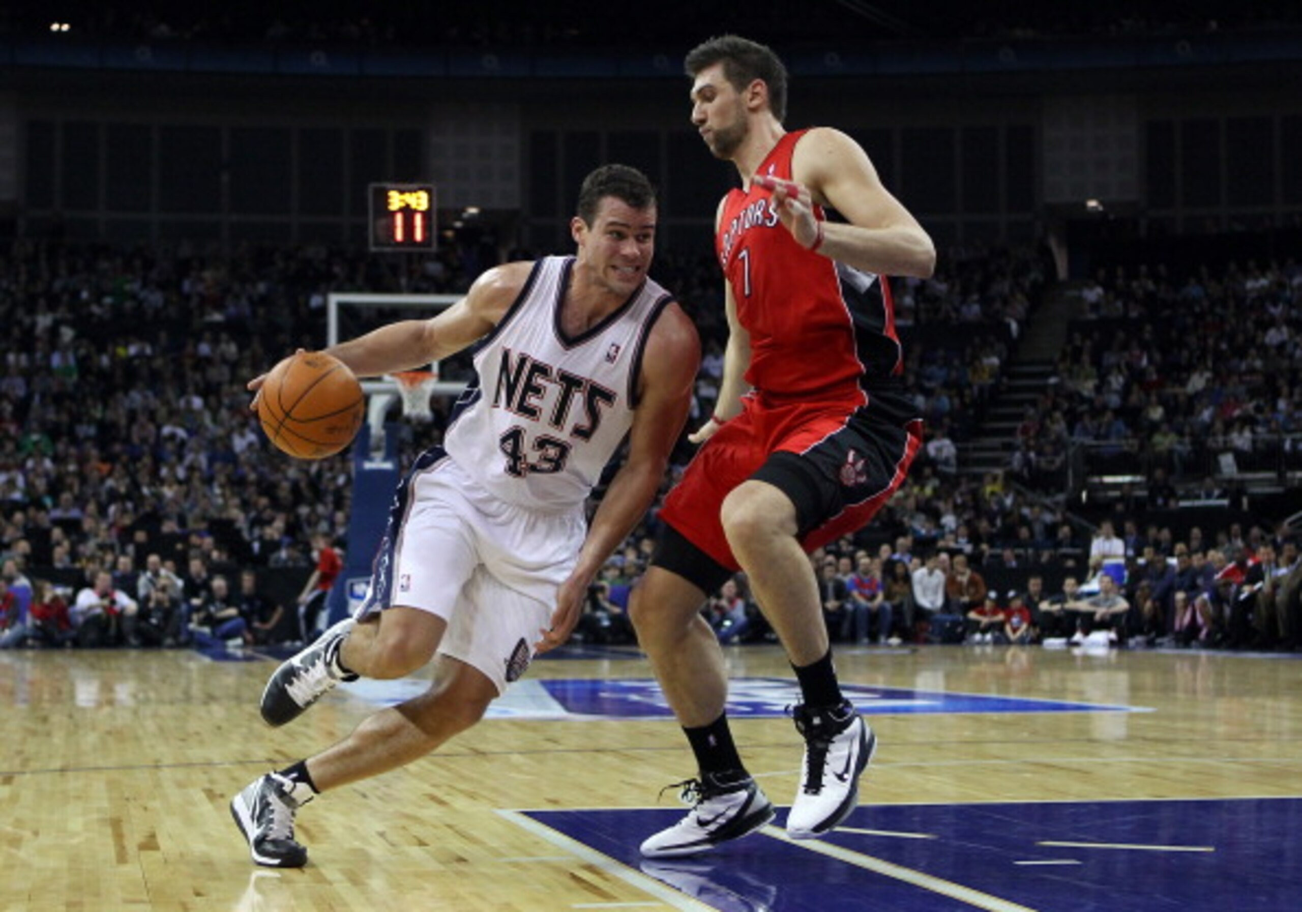 LONDON, ENGLAND - MARCH 04: Kris Humphries of the Nets goes around Andrea Bargnani of the Raptors during the NBA match between New Jersey Nets and the Toronto Raptors at the O2 Arena on March 4, 2011 in London, England. NOTE TO USER: User expressly ackno LONDON, ENGLAND - MARCH 04: Kris Humphries of the Nets goes around Andrea Bargnani of the Raptors during the NBA match between New Jersey Nets and the Toronto Raptors at the O2 Arena on March 4, 2011 in London, England. NOTE TO USER: User expressly ackno