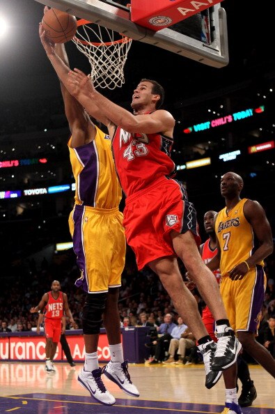 LOS ANGELES, CA - JANUARY 14:  Kris Humphries #43 of the New Jersey Nets shoots over Andrew Bynum #17 of the Los Angeles Lakers at Staples Center on January 14, 2011 in Los Angeles, California. The Lakers won 100-88.  NOTE TO USER: User expressly acknowle