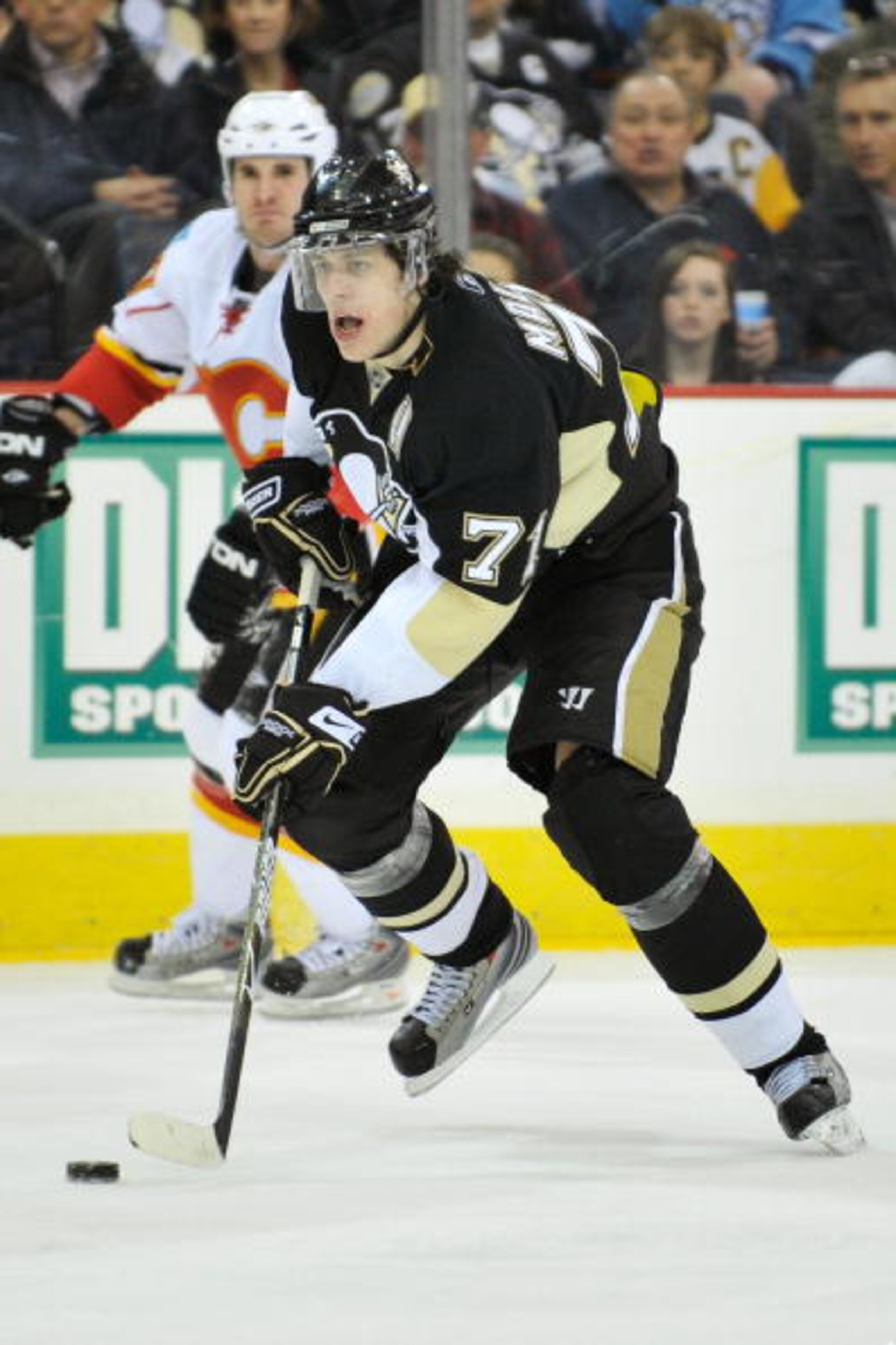 PITTSBURGH - MARCH 25:  Forward Evgeni Malkin #71 of the Pittsburgh Penguins skates with the puck against the Calgary Flames on March 25, 2009 at Mellon Arena in Pittsburgh, Pennsylvania.  (Photo by Jamie Sabau/Getty Images)