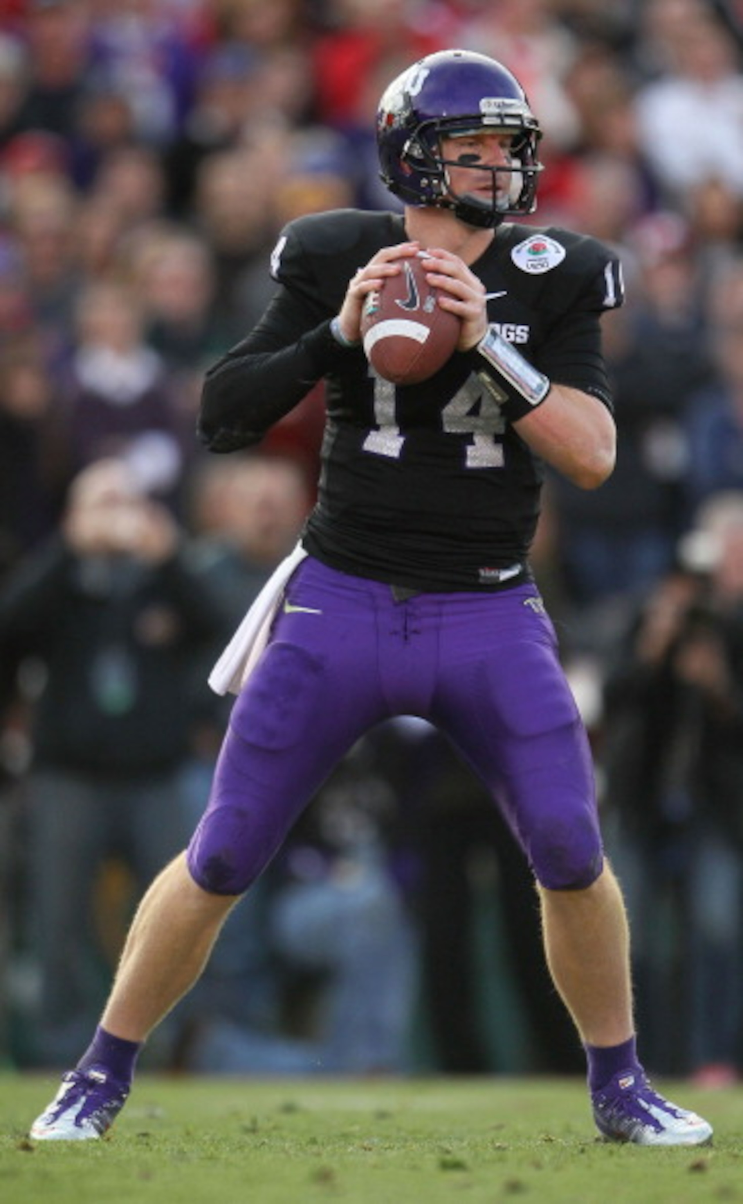 PASADENA, CA - JANUARY 01:  Quarterback Andy Dalton #14 of the TCU Horned Frogs looks to pass against the Wisconsin Badgers in the 97th Rose Bowl game on January 1, 2011 in Pasadena, California.  (Photo by Jeff Gross/Getty Images)