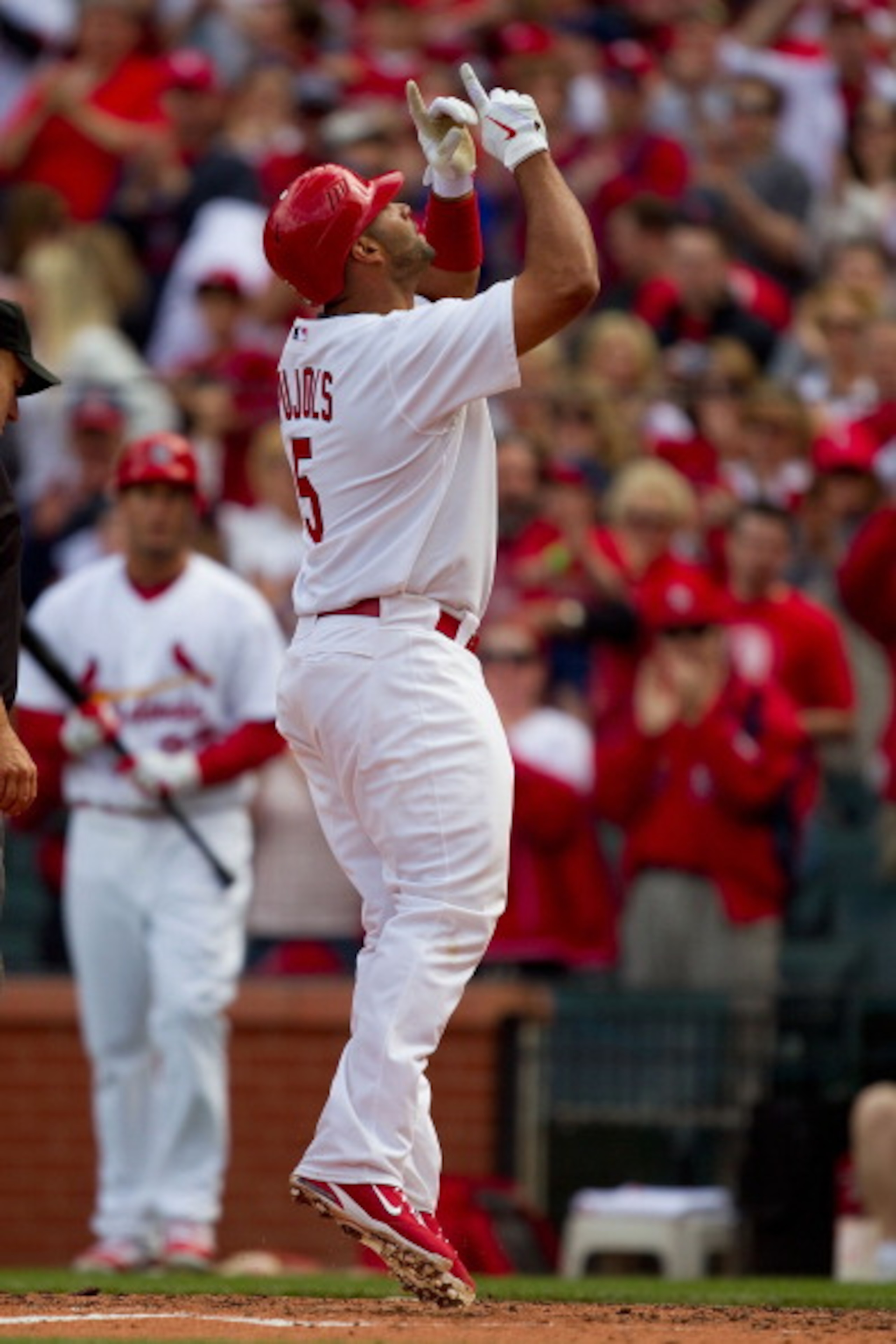 ST. LOUIS, MO - APRIL 2: Albert Pujols #5 of the St. Louis Cardinals celebrates a home run against the San Diego Padres at Busch Stadium on April 2, 2011 in St. Louis, Missouri.  (Photo by Dilip Vishwanat/Getty Images)