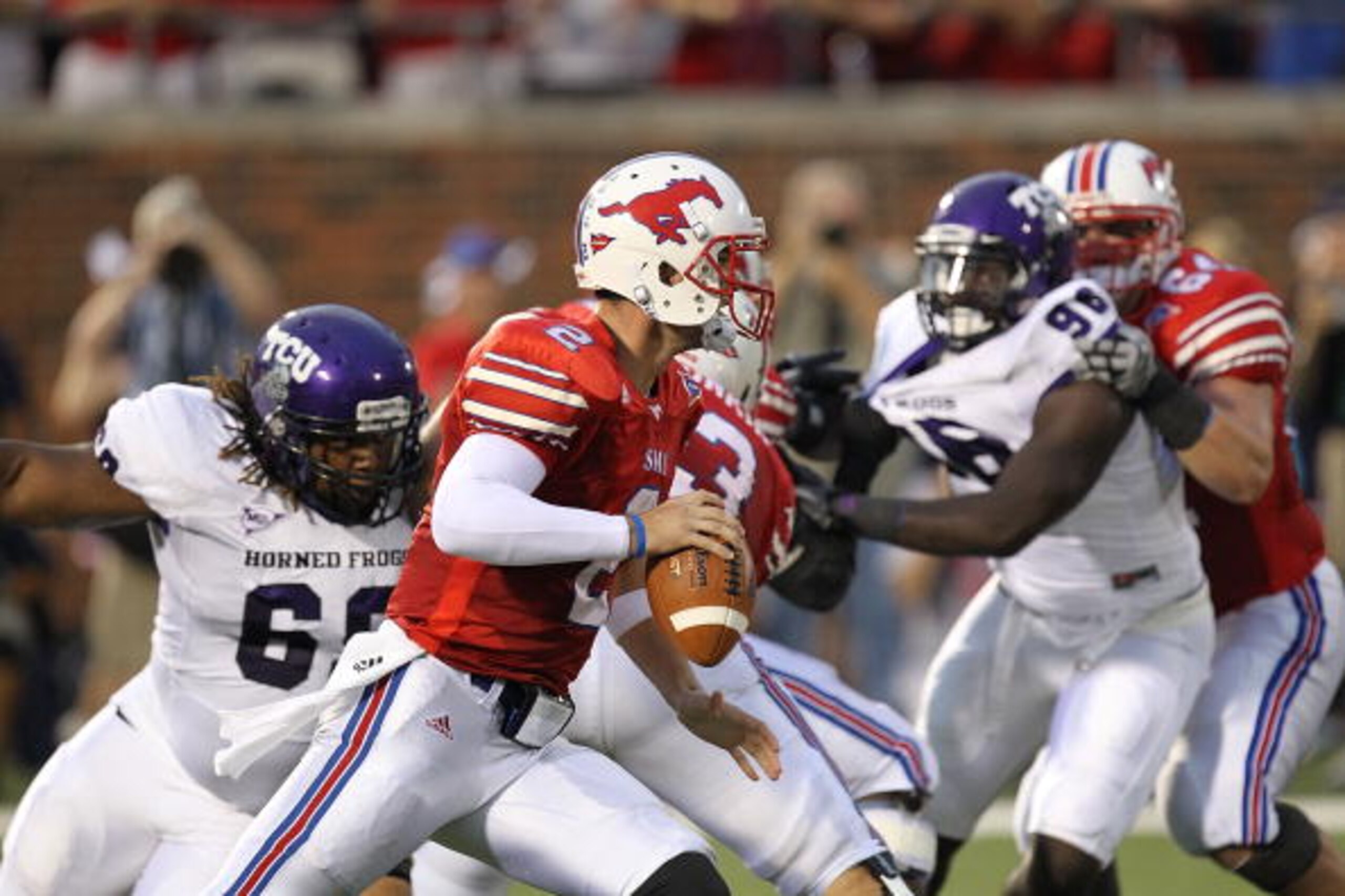 DALLAS - SEPTEMBER 24:  Quarterback Kyle Padron #2 of the SMU Mustangs looks to pass against the TCU Horned Frogs at Gerald J. Ford Stadium on September 24, 2010 in Dallas, Texas.  (Photo by Ronald Martinez/Getty Images)