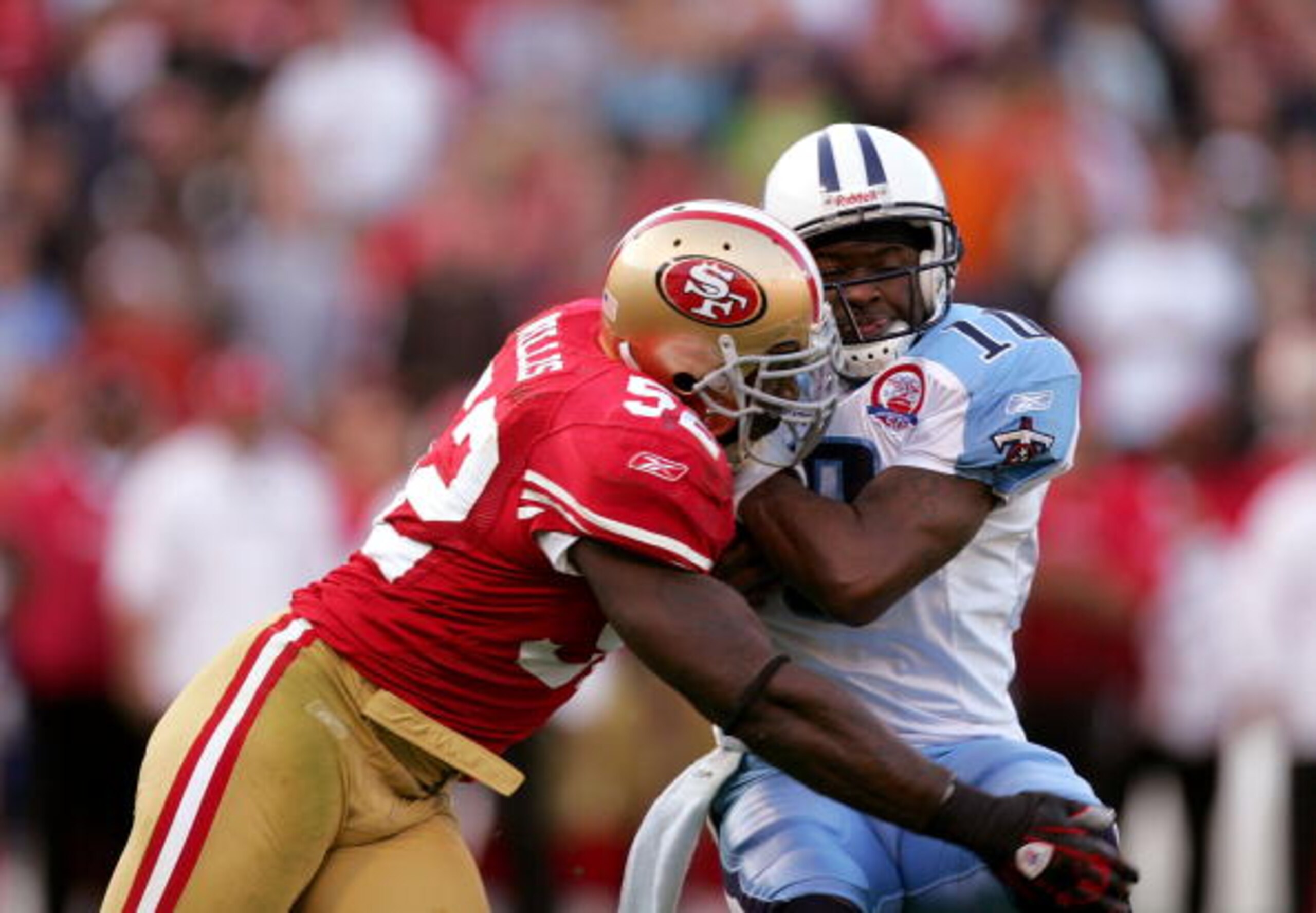 SAN FRANCISCO - NOVEMBER 08:  Patrick Willis #52 of the San Francisco 49ers tackles Vince Young #10 of the Tennessee Titans at Candlestick Park on November 8, 2009 in San Francisco, California.  (Photo by Ezra Shaw/Getty Images)