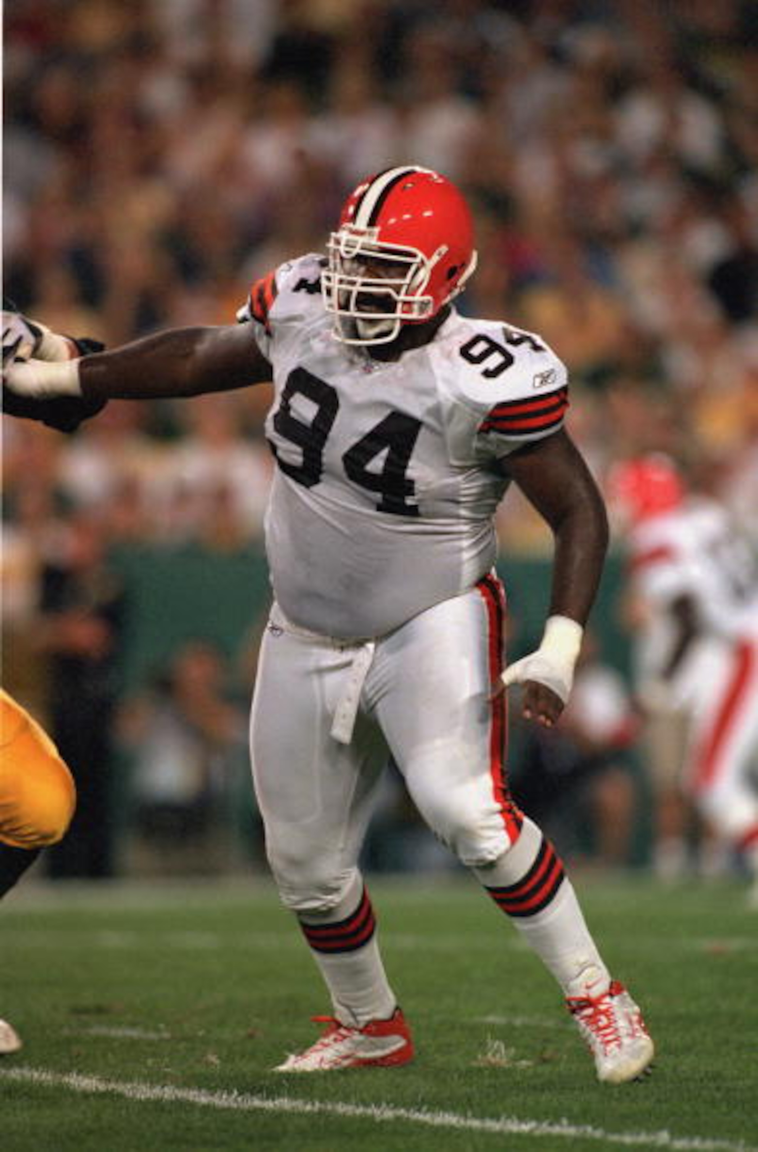 GREEN BAY, WI- AUGUST 26:  Gerrard Warren #94 of the  Cleveland Browns moves on the field during the game against the Green Bay Packers at Lambeau Field on August 26,2002 in Green Bay, Wisconsin. The Packer won 27-20. ( Photo by: Jonathan Daniel/Getty Ima