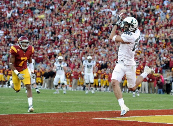 LOS ANGELES, CA - OCTOBER 30:  Jeff Maehl #23 of the Oregon Ducks makes a catch for a touchdown in front of T.J McDonald #7 of the USC Trojans for a 7-3 lead during the first quarter at Los Angeles Memorial Coliseum on October 30, 2010 in Los Angeles, Cal