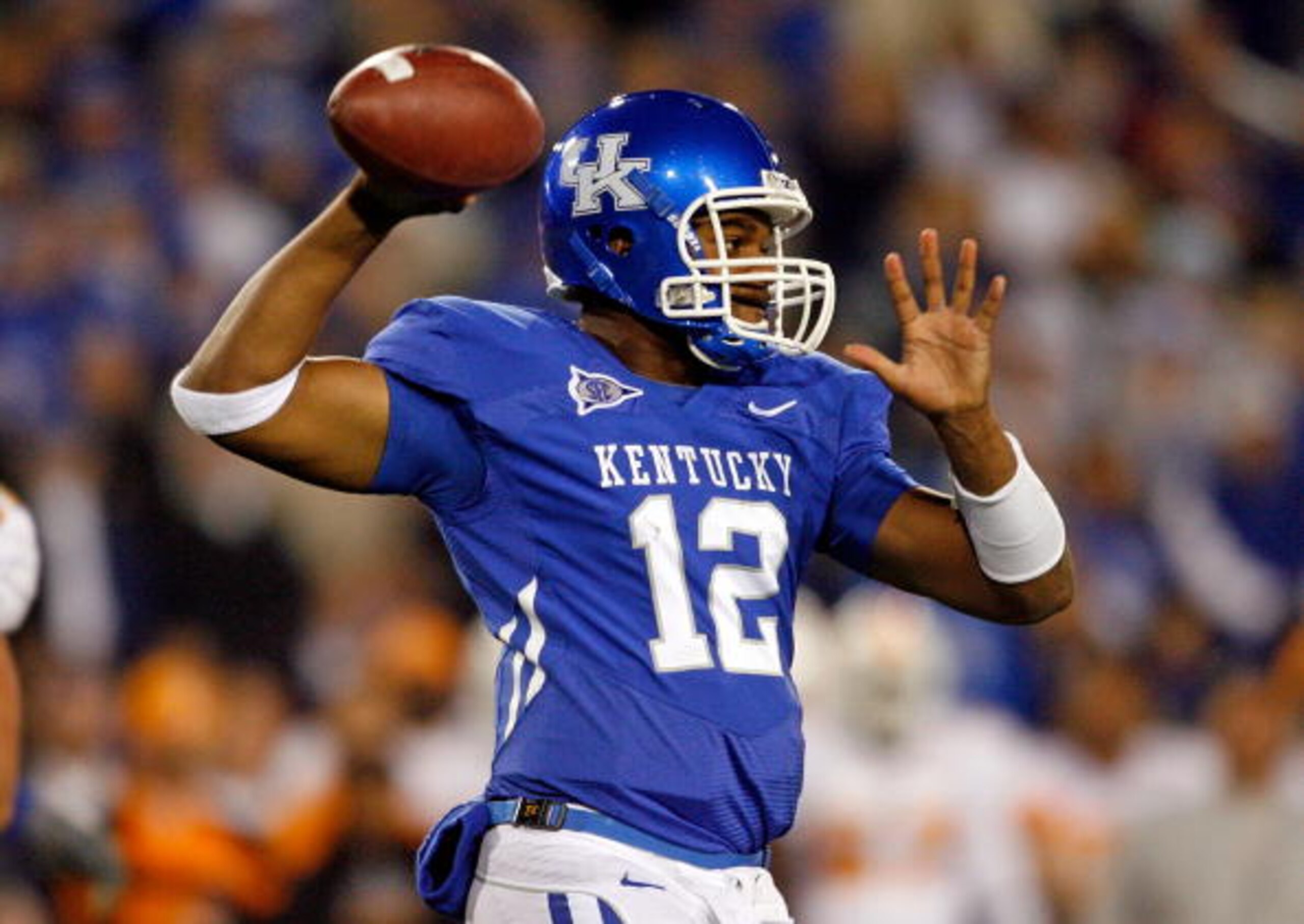 LEXINGTON, KY - NOVEMBER 28:  Morgan Newton #12 of the Kentucky Wildcats throws the ball against the Tennessee Volunteers during the SEC game at Commonwealth Stadium on November 28, 2009 in Lexington, Kentucky.  (Photo by Andy Lyons/Getty Images)