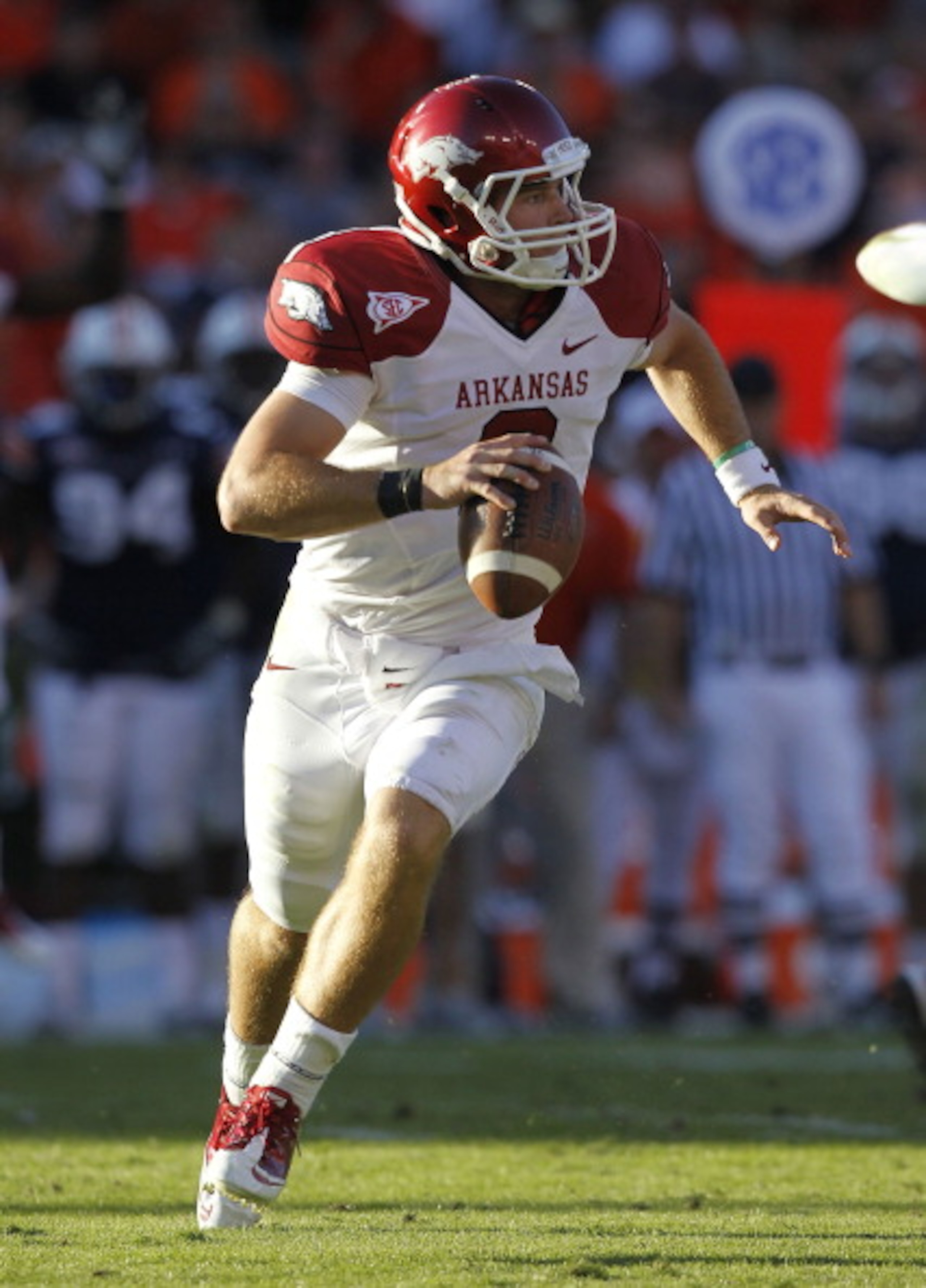 AUBURN, AL - OCTOBER 16:  Quarterback Tyler Wilson #8 of the Arkansas Razorbacks rolls out and looks downfield for a receiver during the game against the Auburn Tigers at Jordan-Hare Stadium on October 16, 2010 in Auburn, Alabama.  The Tigers beat the Raz